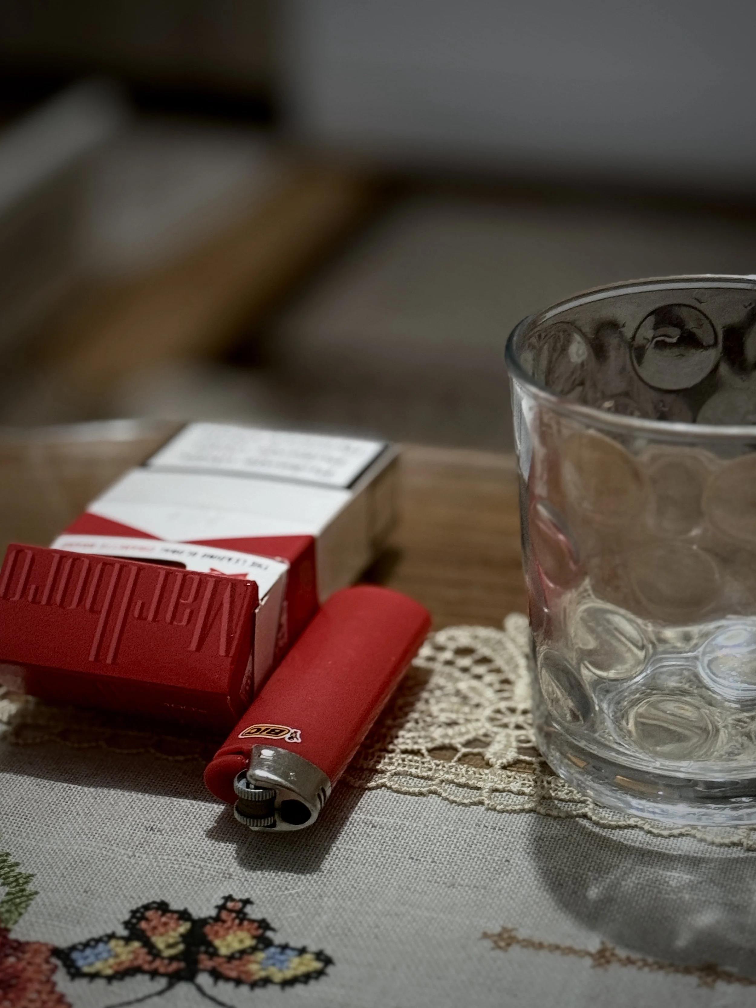 Cigarettes and a glass on the table in the home of Saliha Osmanović in Dobrak, Bosnia and Herzegovina.
Without her family around her, she said cigarettes have become her daily companions.