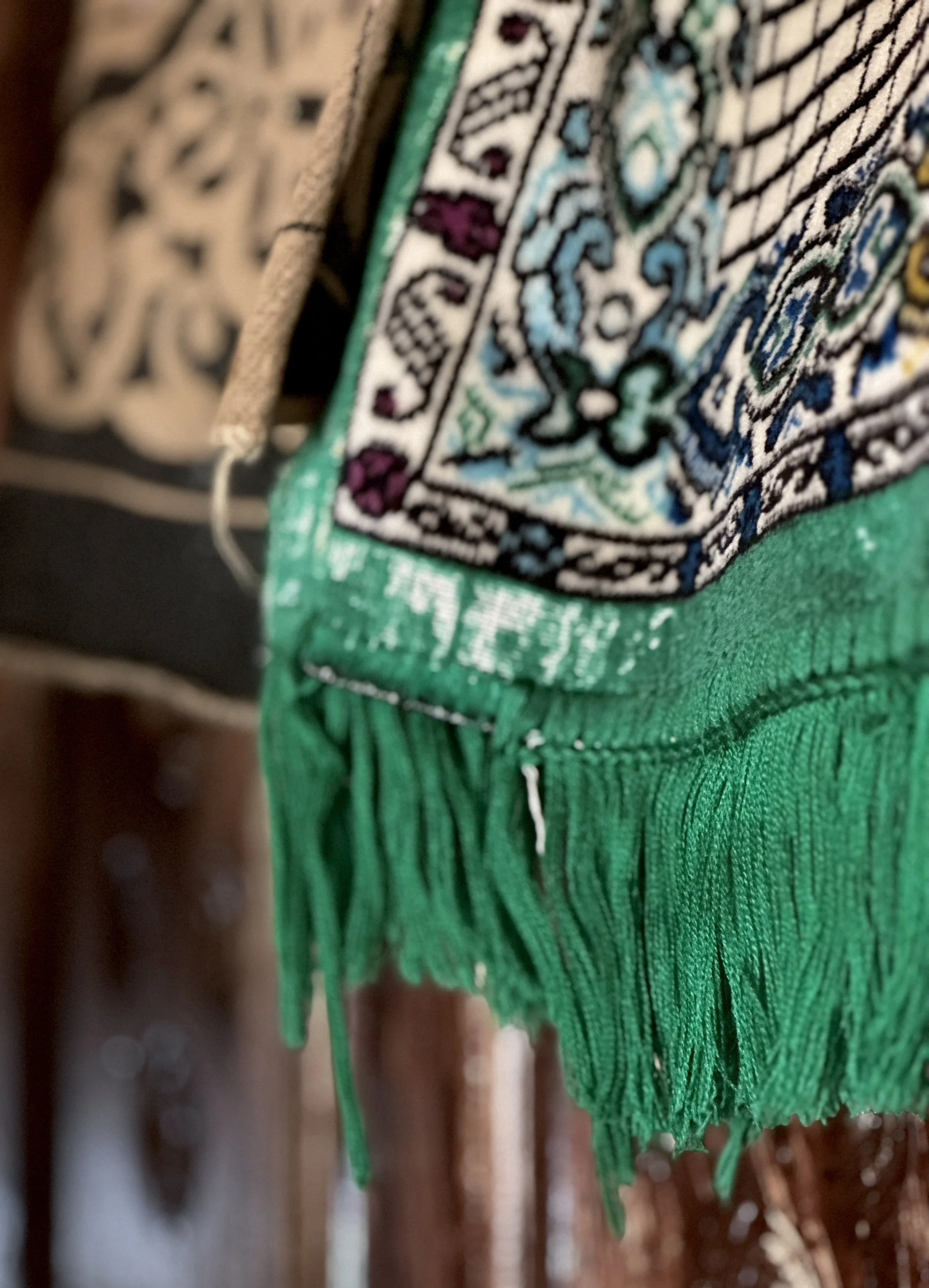 A textile hangs inside the apartment of Dalila Abdo Ahmed in Taiz, Yemen, where she lives after being displaced by the conflict.