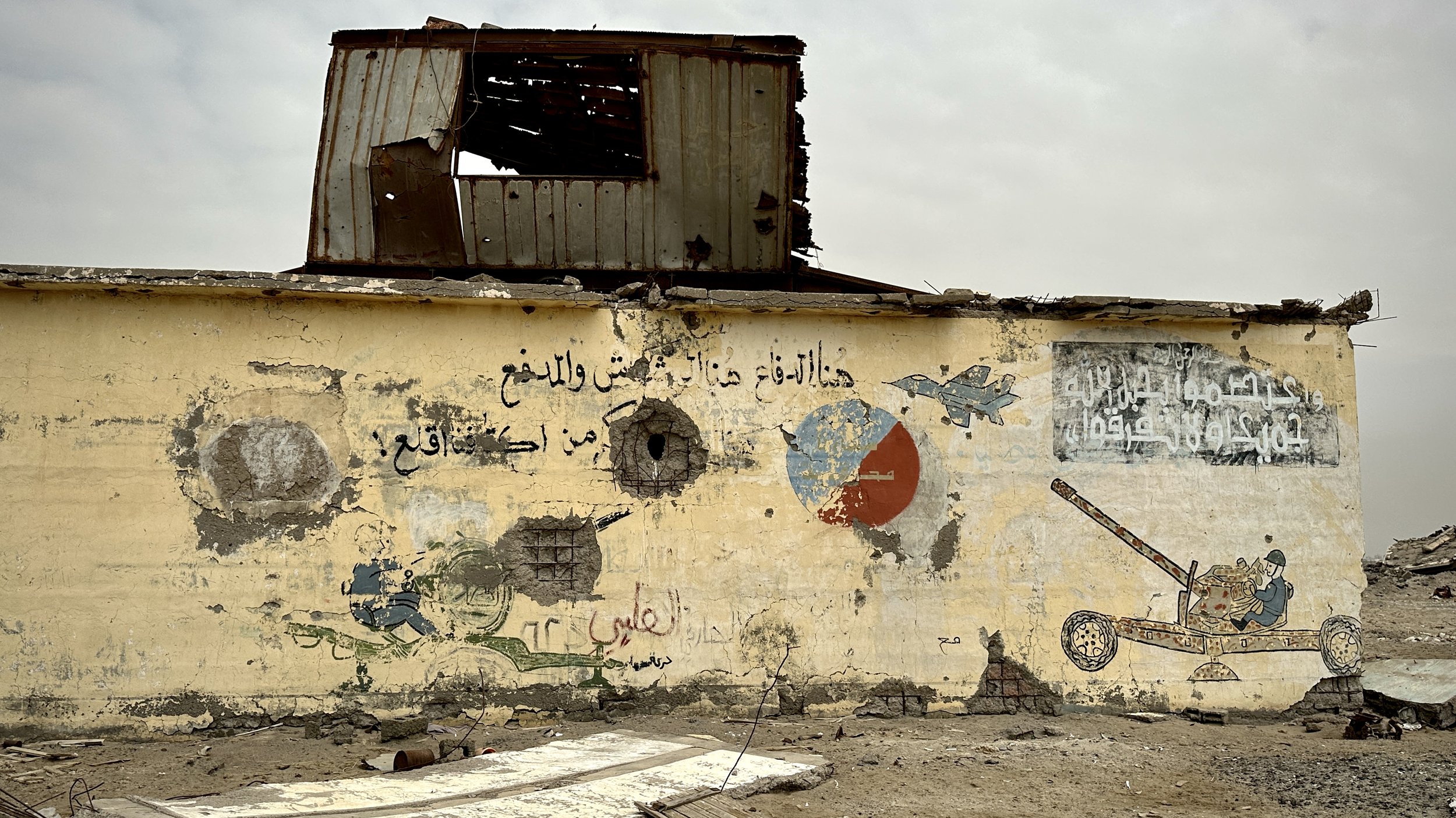 War-damaged airport buildings remain standing inside Aden International Airport years after fighting swept through the area in 2015. Clearance teams say former defensive positions, broken structures and disturbed ground can complicate efforts to loca