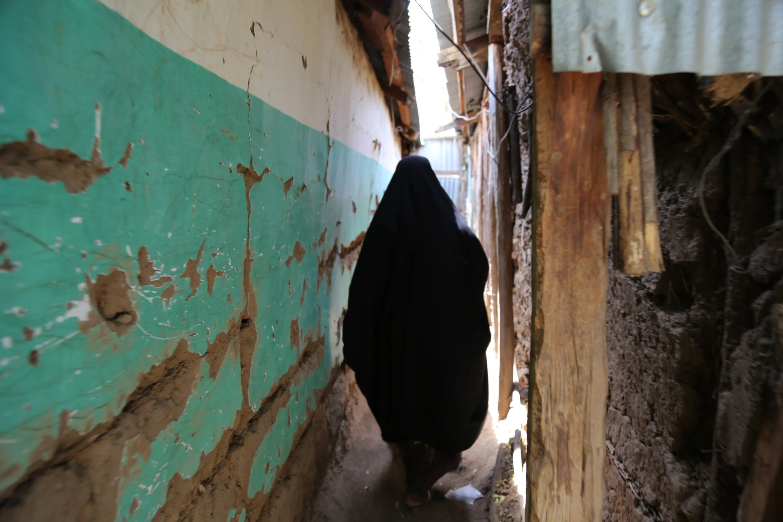 Mariam in Kakuma

Mariam Nininahazwe, a Burundian refugee, walks through an alley in Kakuma Refugee Camp. A single mother and the sole provider for her children in the camp, she supports her family through small businesses run from her home.