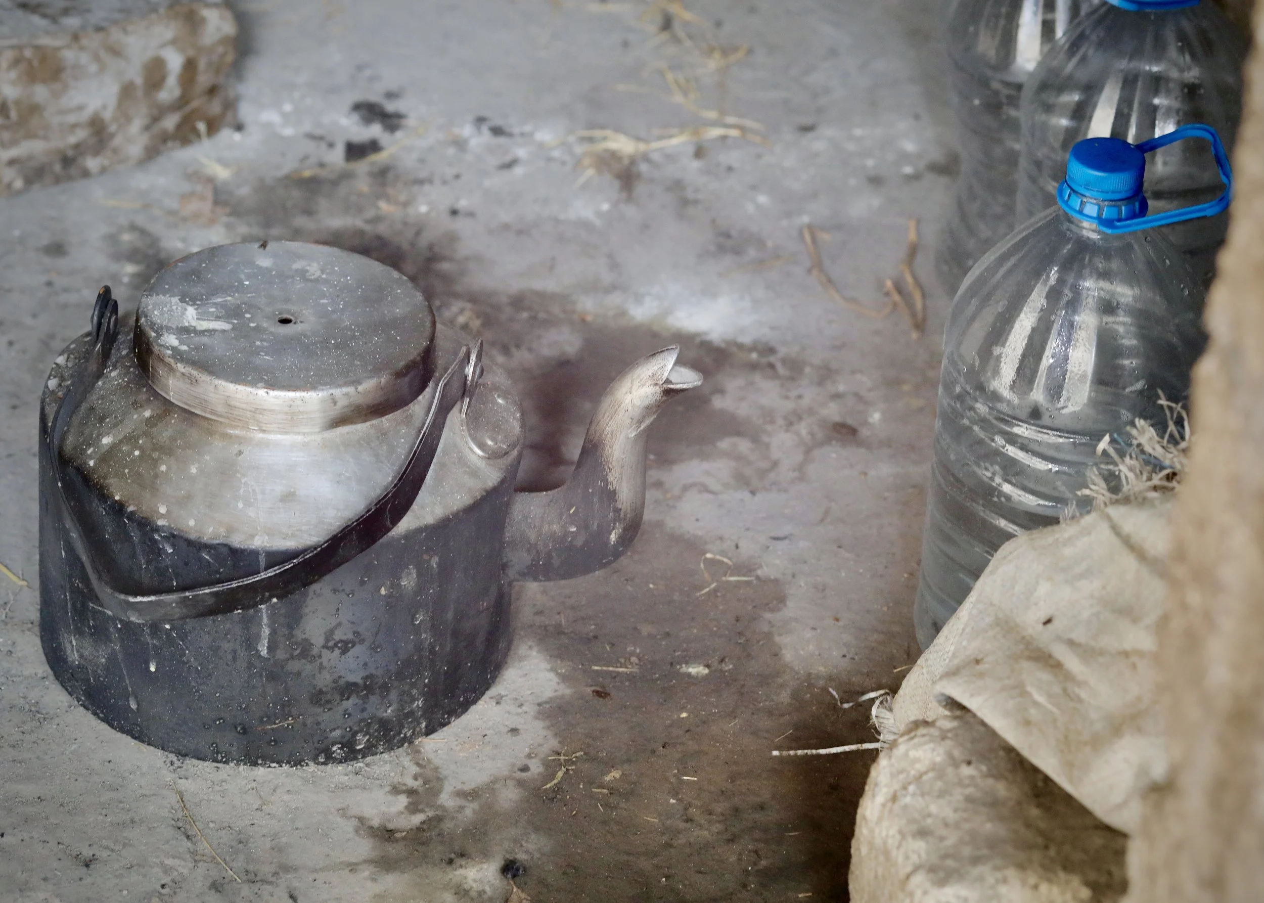 The outdoor kitchen of Mosaid Mohammed Ali Naji, Shakhab, Al Dhale. Domestic objects in the compound where a landmine detonated on his return from displacement.