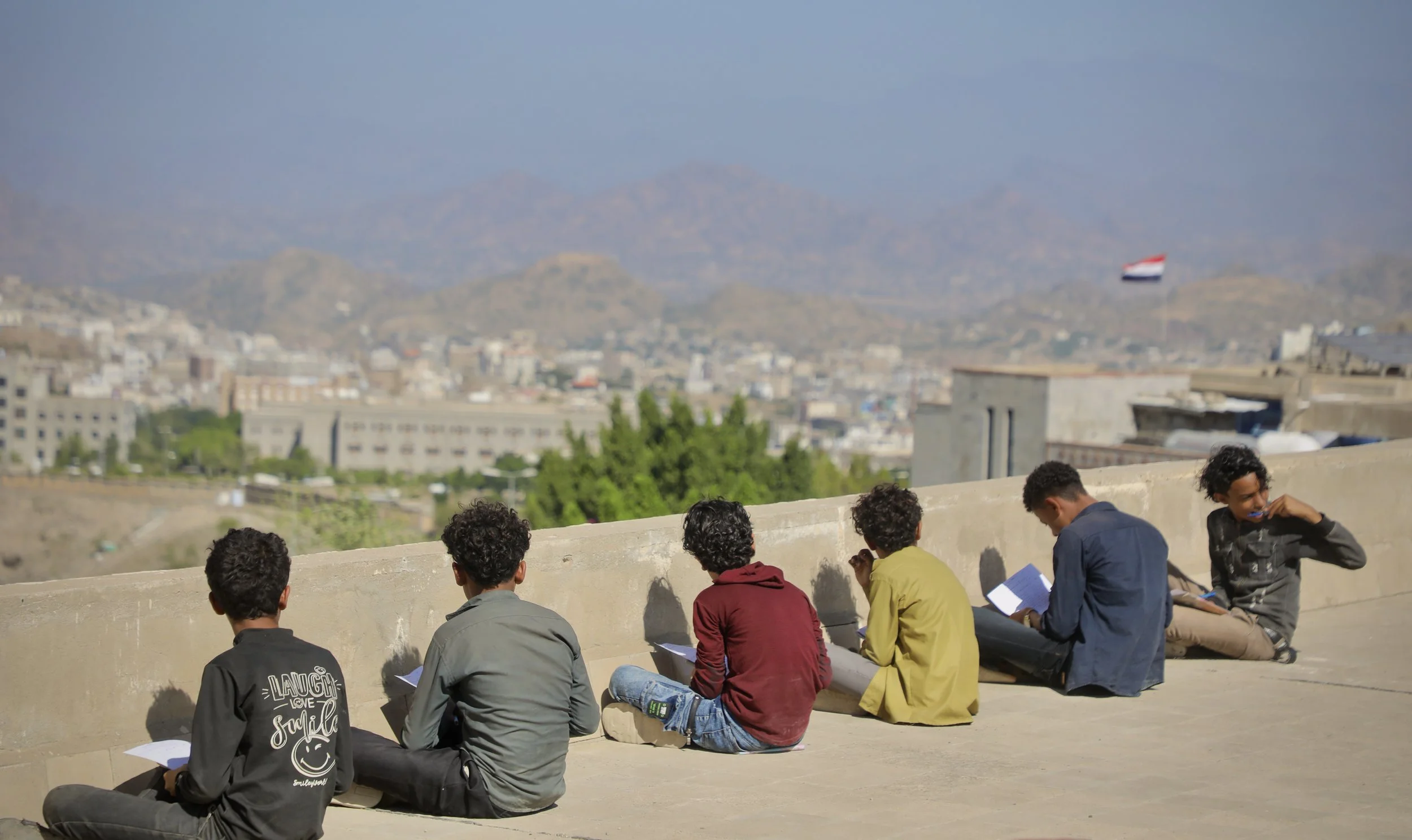 Students take exams on the rooftop of Ibrahim Aqeel School in Taiz, Yemen, after damage to the school left insufficient classroom space for pupils.