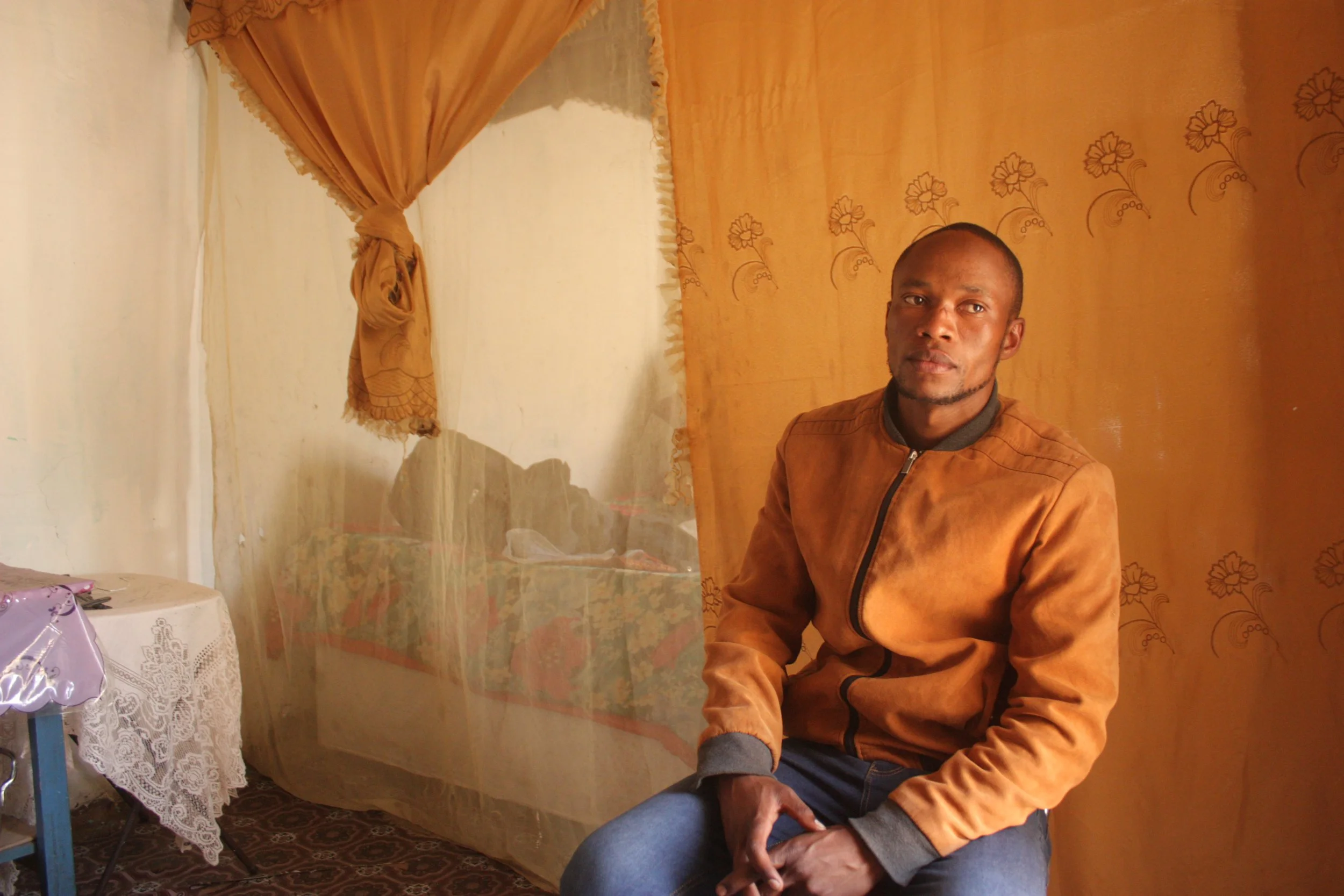 A portrait of youth advocate Pheto Kutumela inside his home in Ha Makunyapane, a remote village in Lesotho’s Thaba-Tseka district. Through Sentebale’s Let Youth Lead programme, Pheto works with families affected by poverty, disability and limited acc