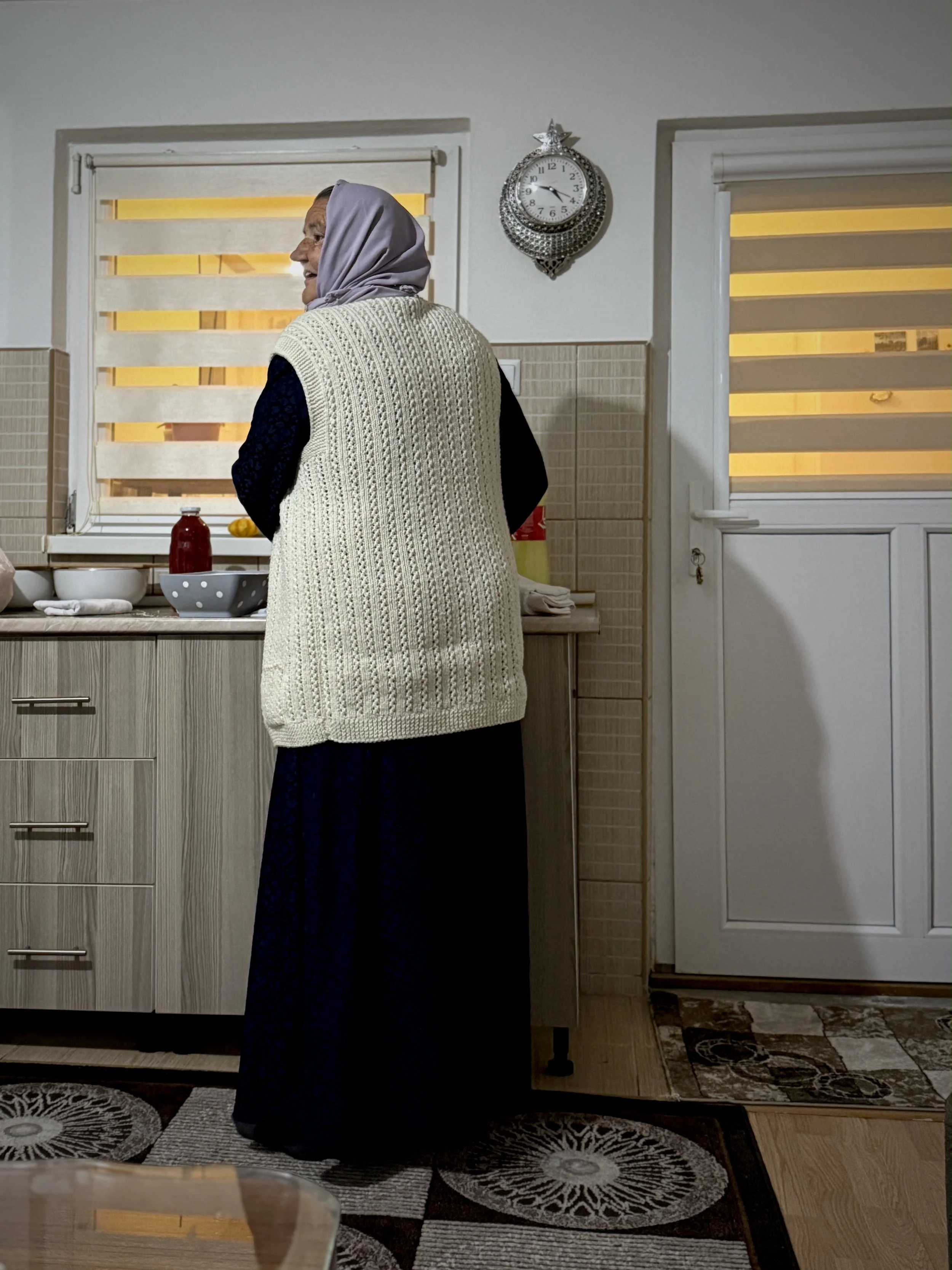 Saliha Osmanović in the kitchen of her home in Dobrak, Bosnia and Herzegovina.
The routines of cooking, cleaning and preparing meals continue in a house shaped by memory and absence.