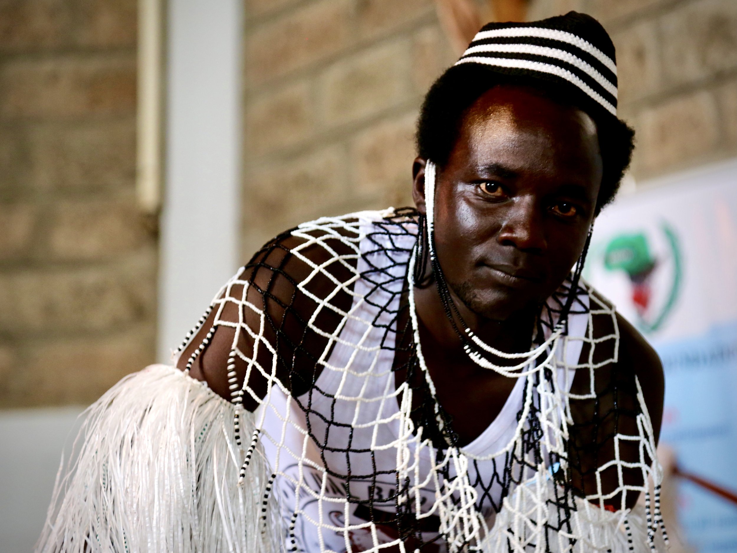 A refugee performer poses for a portrait backstage during World Refugee Day celebrations at Divine Word Church in Nairobi.
