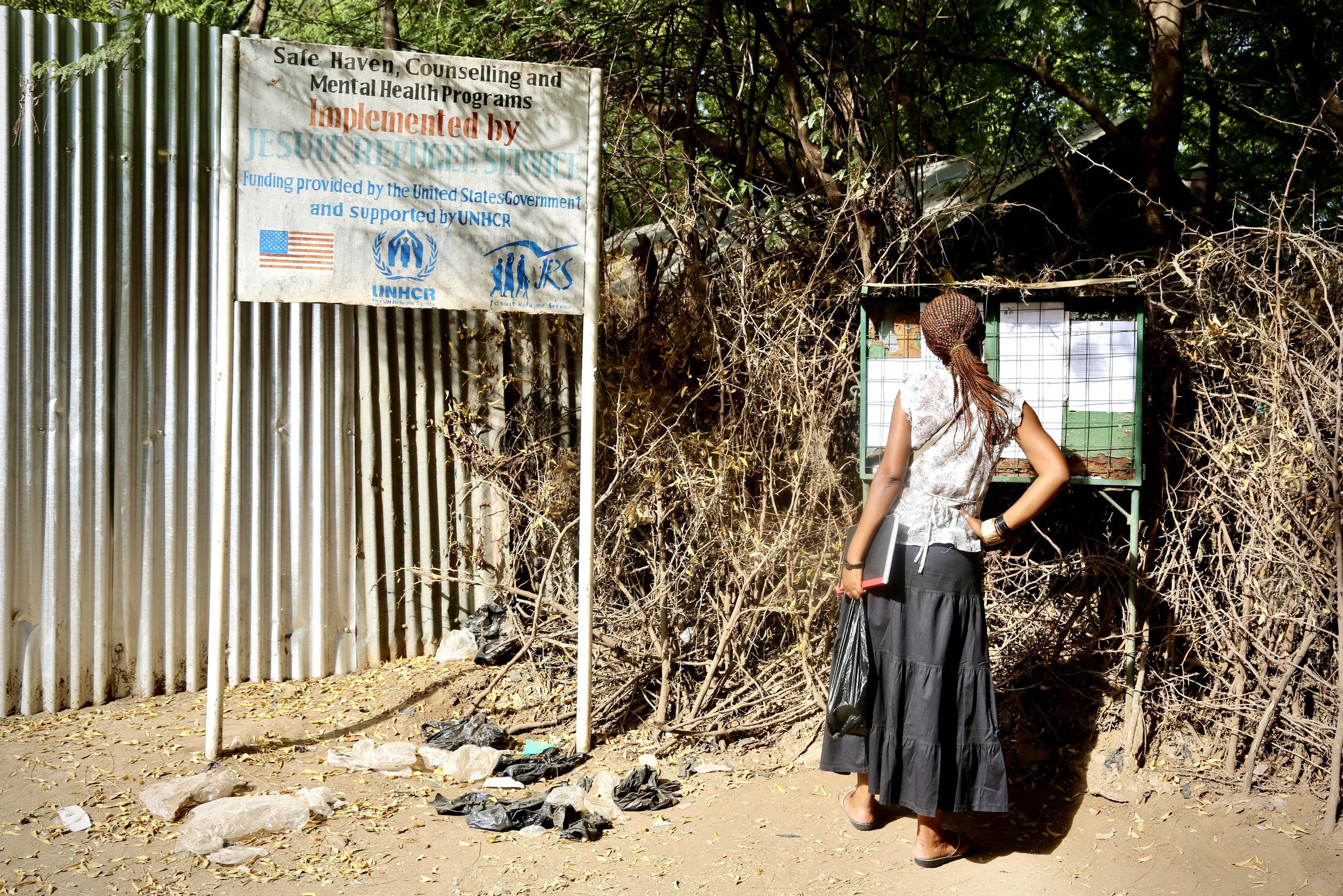The entrance to the Safe Haven is partially hidden behind fencing in Kakuma, reflecting the need for privacy and security for residents facing threats.