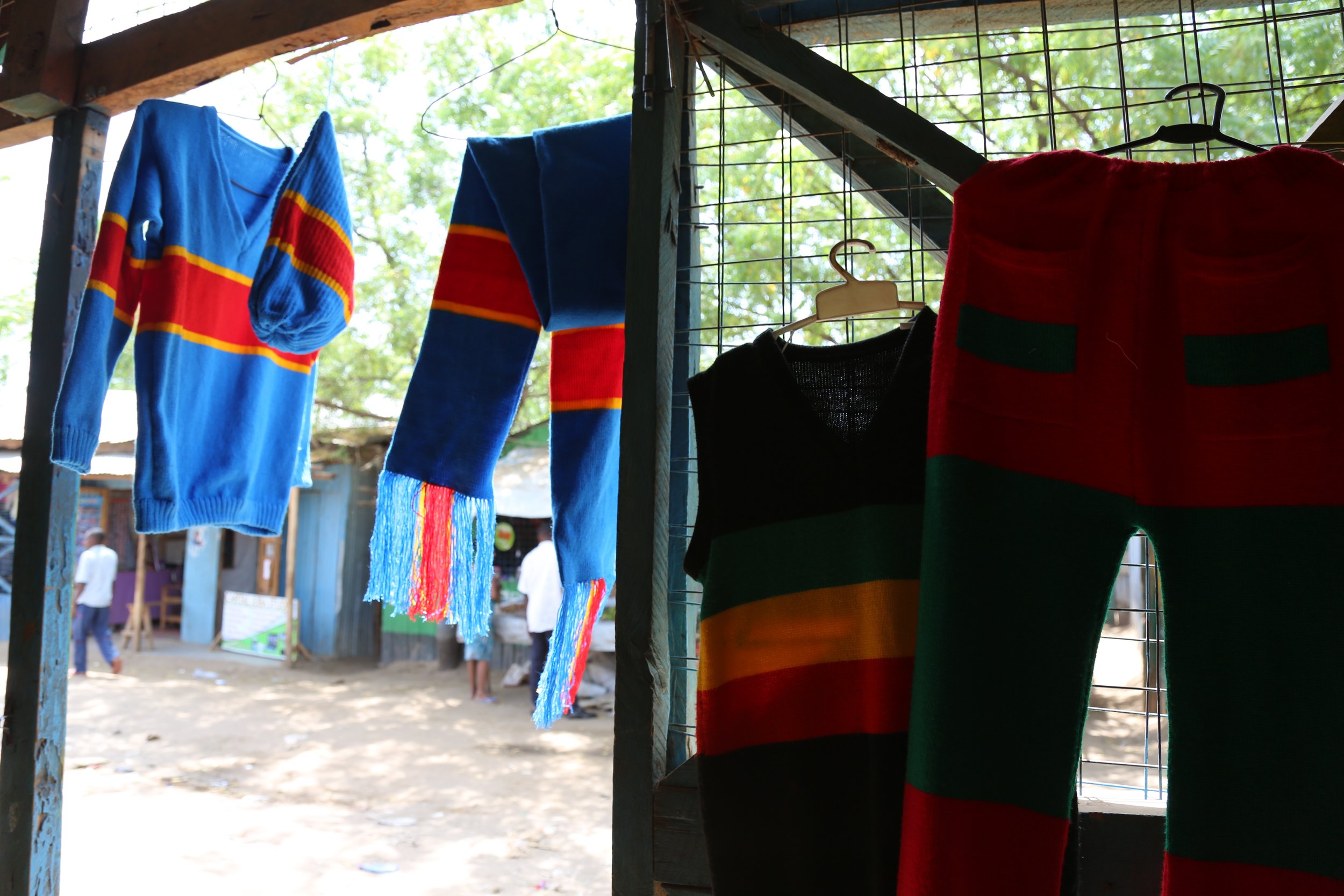 Tailoring workspace

Clothing hangs inside the small tailoring space where Mariam Nininahazwe sews garments for residents of Kakuma refugee camp.
