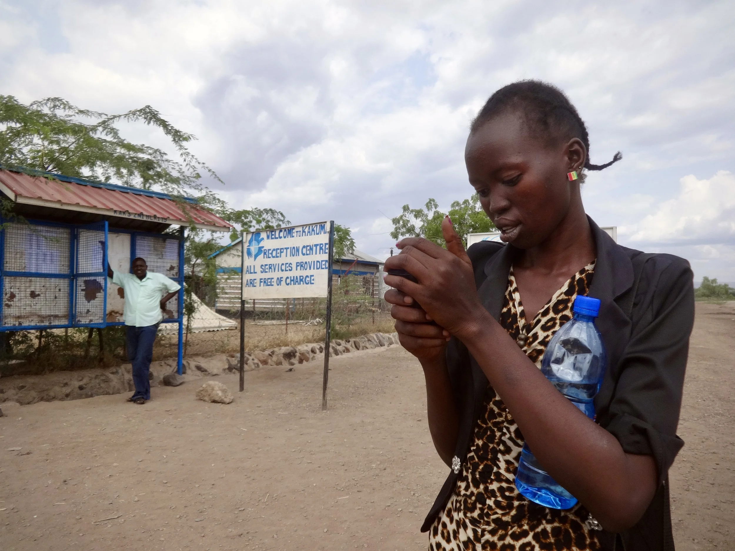Randa texts her mother after arriving at Kakuma reception centre, using phone credit provided on arrival to let her know she had made it safely. She had been separated from her family by the South Sudan civil war in 2013, while her mother and sibling