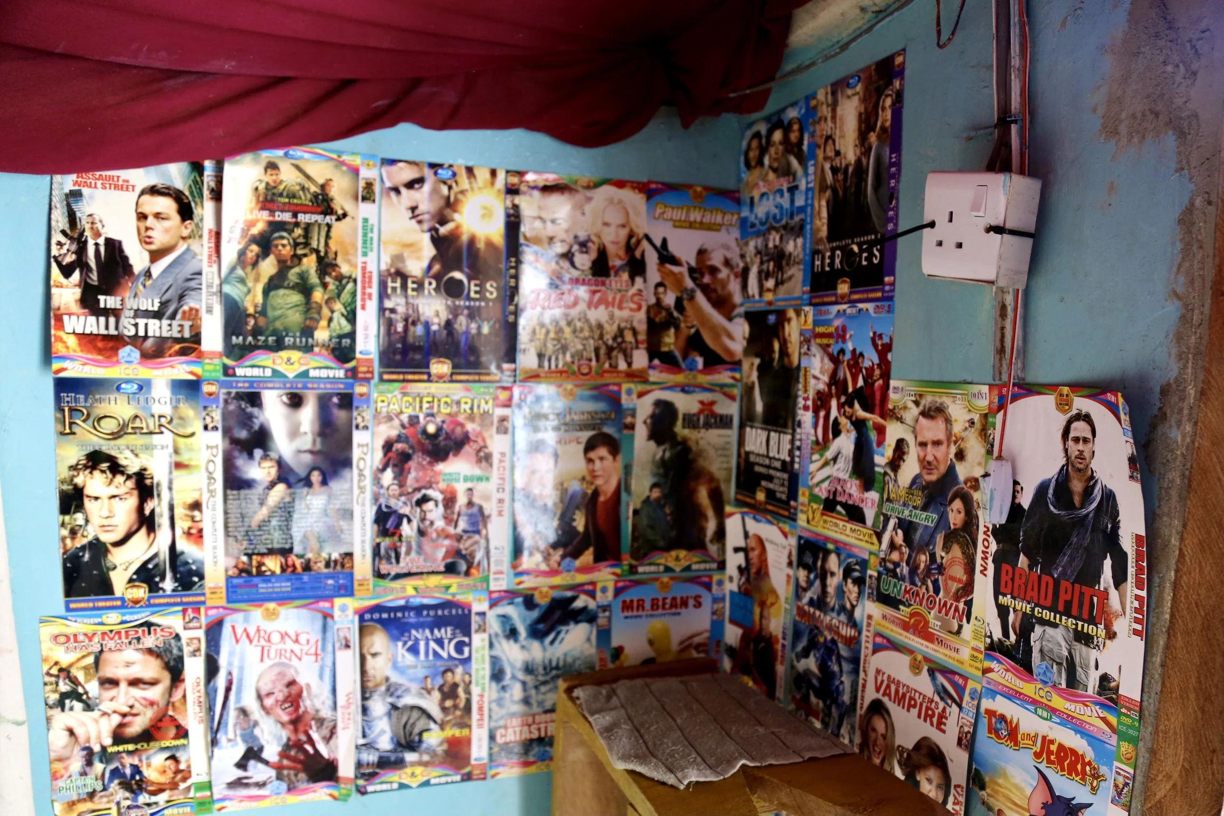 Film posters cover the walls of Wabenga’s studio, reflecting global influences and creative aspirations shaped inside the camp.