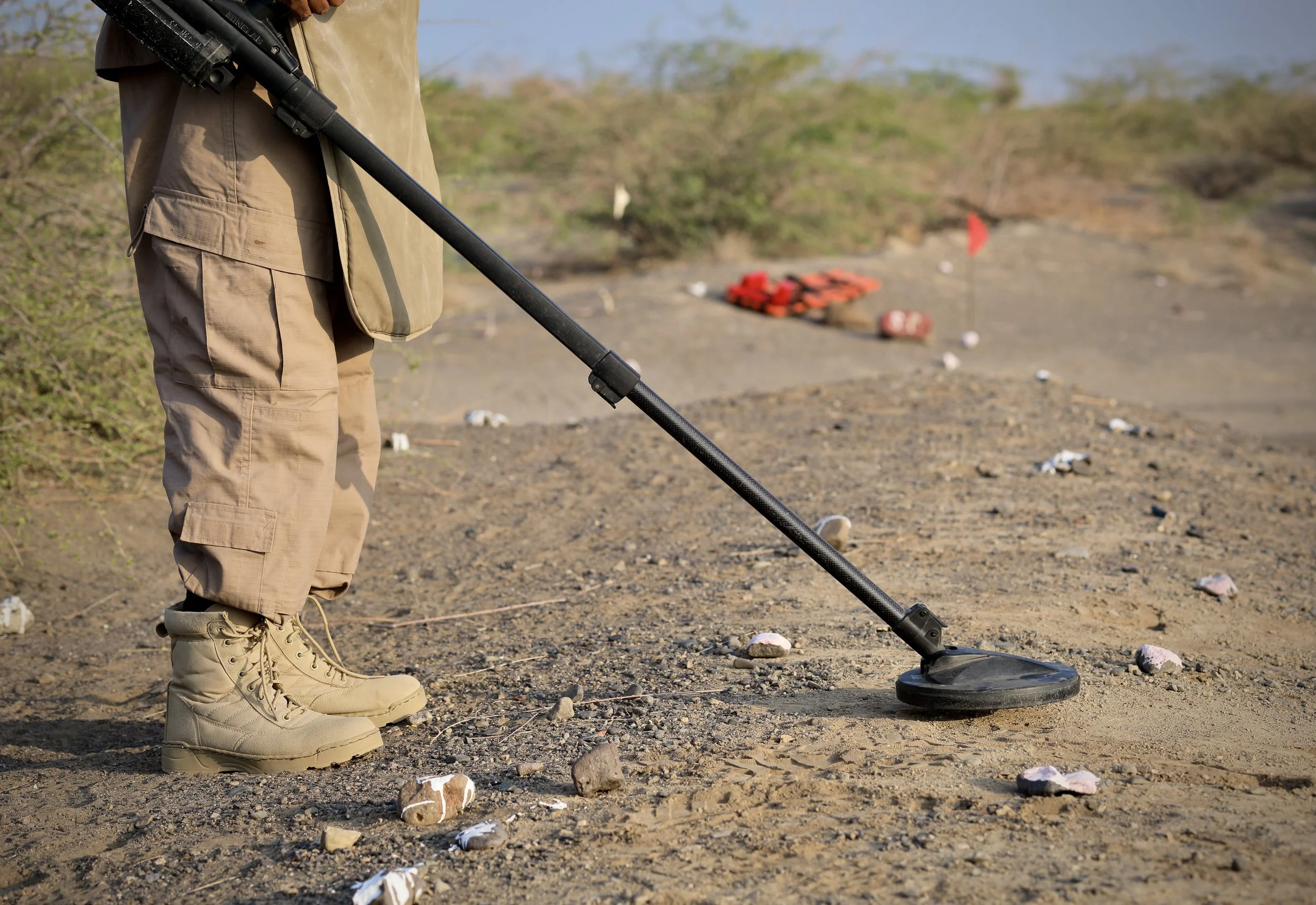 A deminer uses a metal detector to scan the ground during clearance operations in Al Remah, near Mocha, Taiz governorate, Yemen.