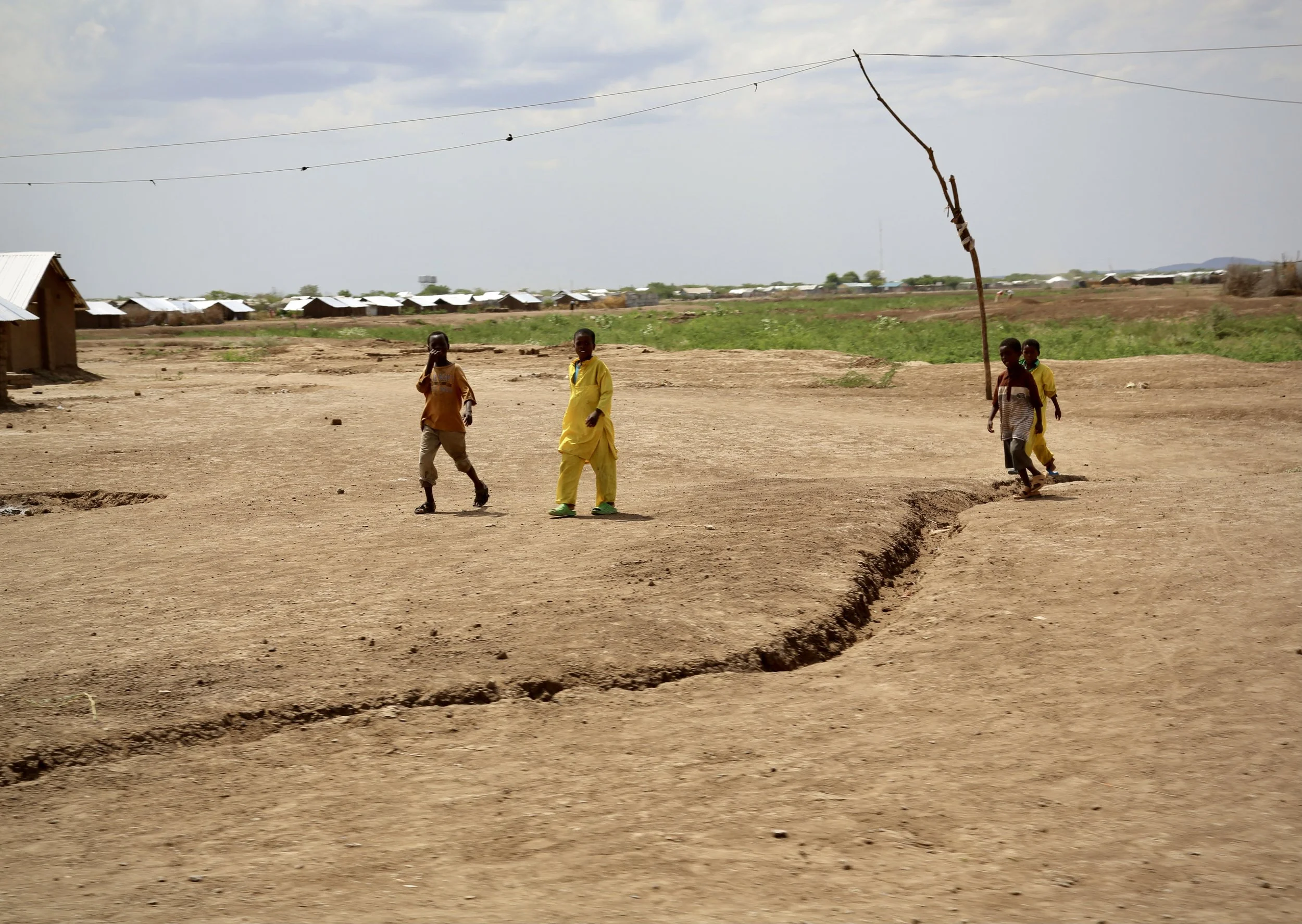 Somali children walk through a predominantly Somali area of Kakuma refugee camp. Residents said fears over violence and sexual attacks against women and girls had become widespread within the community. Kakuma, Kenya, June 2016.