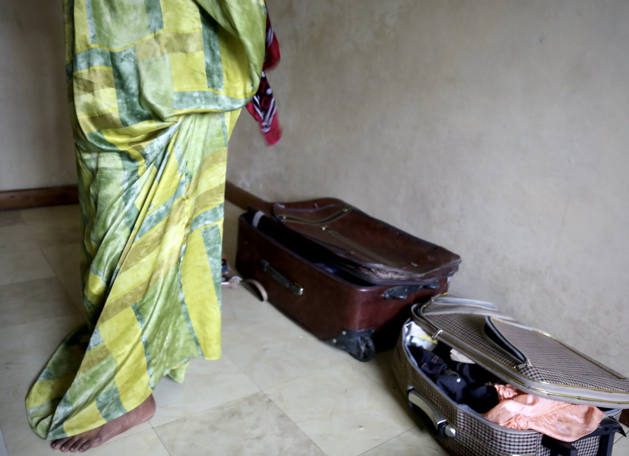Small suitcases and personal belongings inside an apartment occupied by Somali refugee women in Eastleigh, Nairobi. Without valid documentation, the sisters remained uncertain about their future in Kenya. Nairobi, Kenya, June 2016.