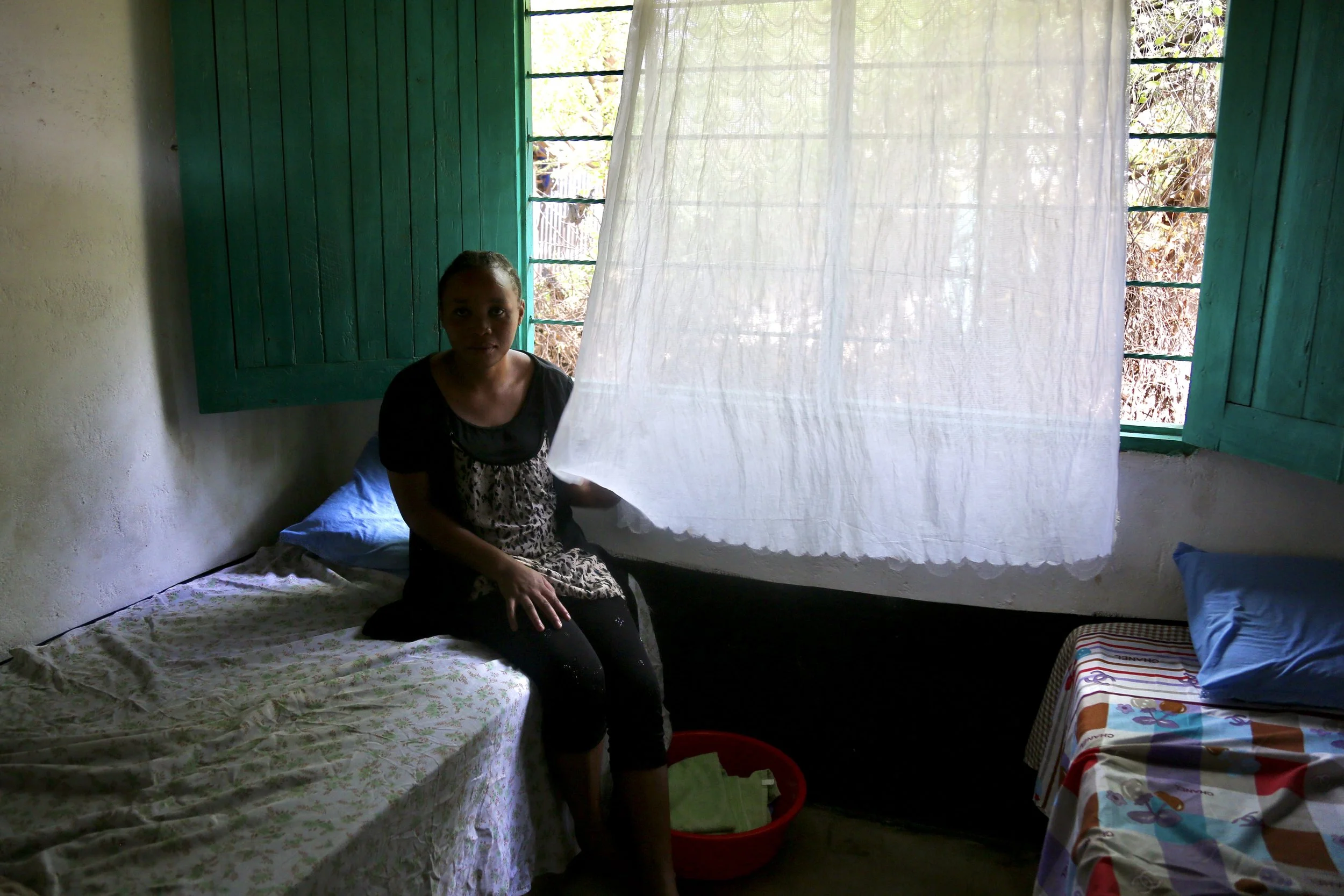 Clarisse sits quietly inside her room in Kakuma. Like many women at the shelter, she was recovering from trauma while waiting for a more secure future.