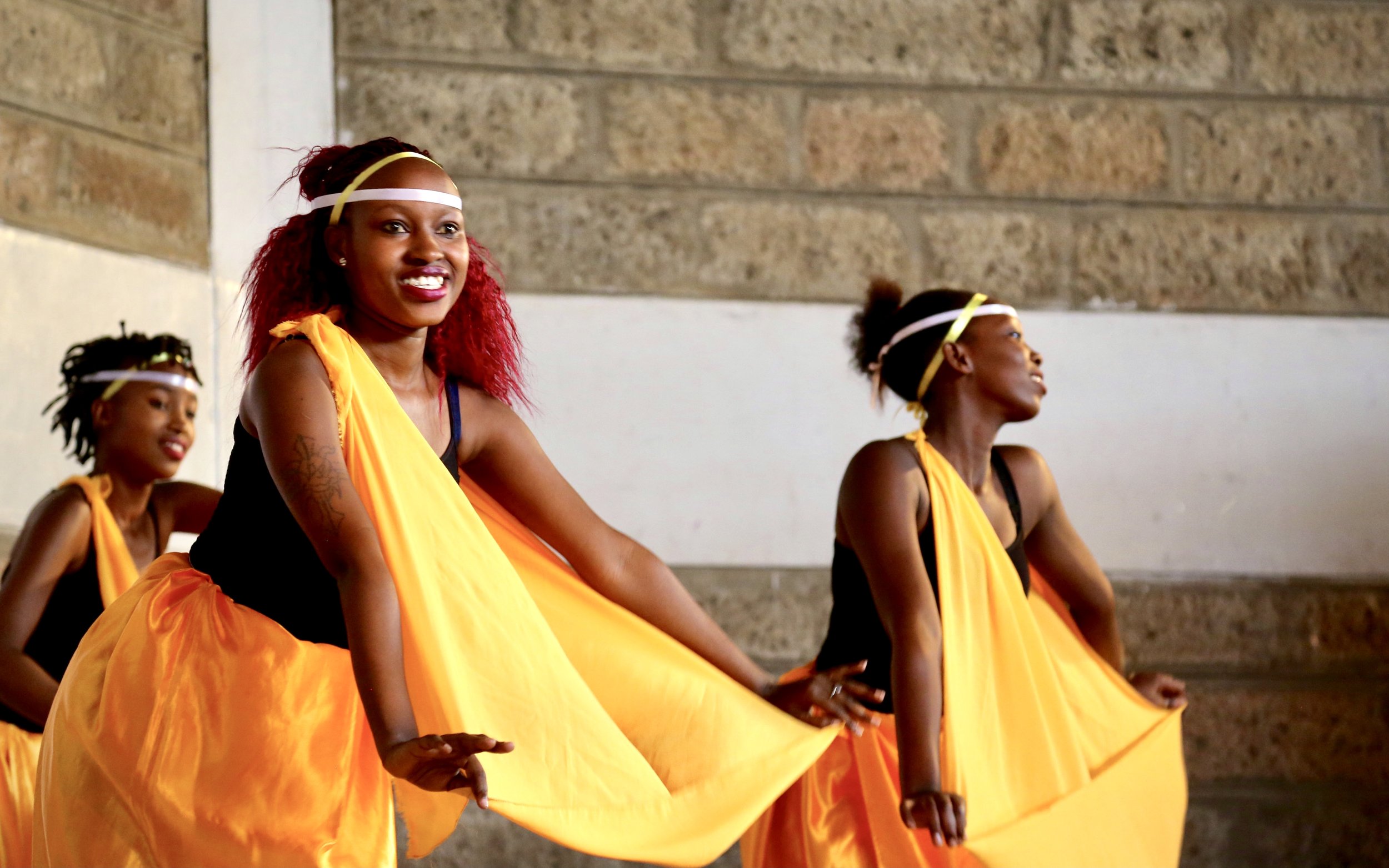 Refugee performers take part in a dance presentation during World Refugee Day celebrations at Divine Word Church in Kayole.