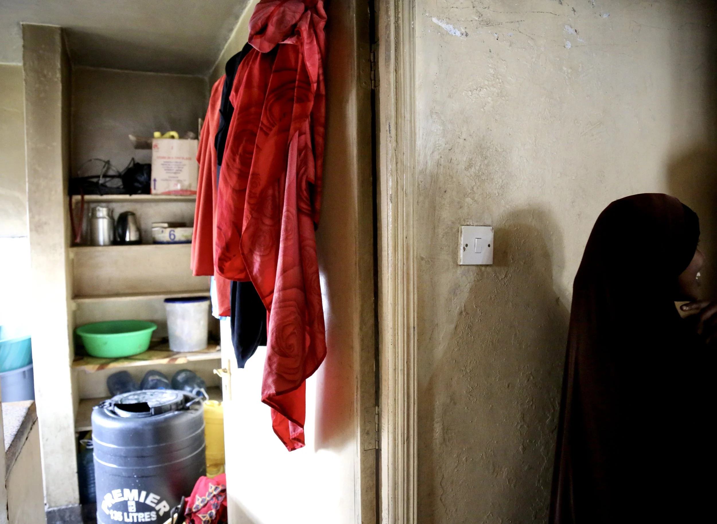 A kitchen area inside an apartment occupied by Somali refugee women in Eastleigh, Nairobi. The sisters relied on relatives and community support while trying to regularise their status. Nairobi, Kenya, June 2016.