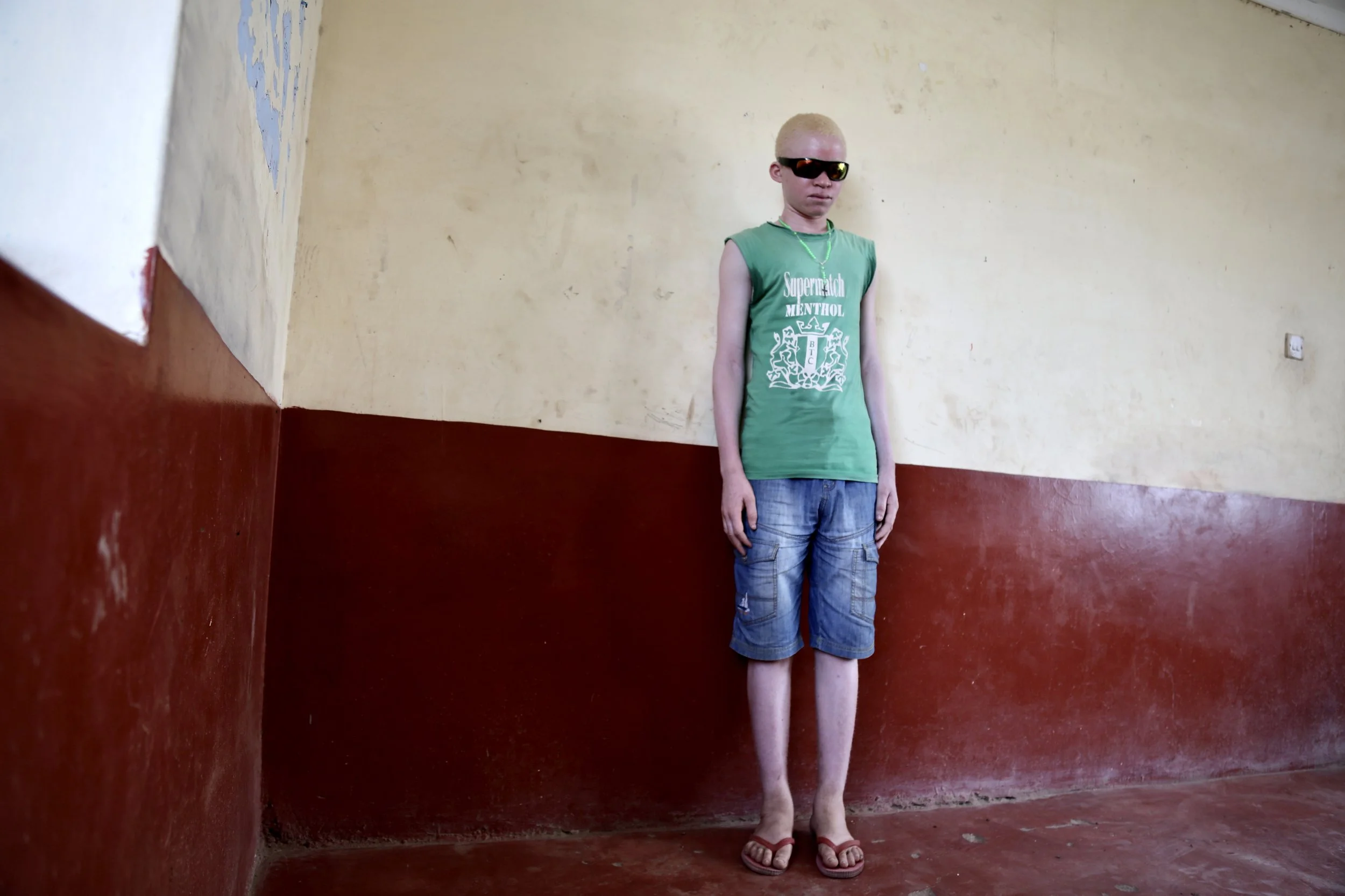 Inside the protection compound, Evariste waits through long days of uncertainty. Outside the walls, he said he feared harassment and abduction.