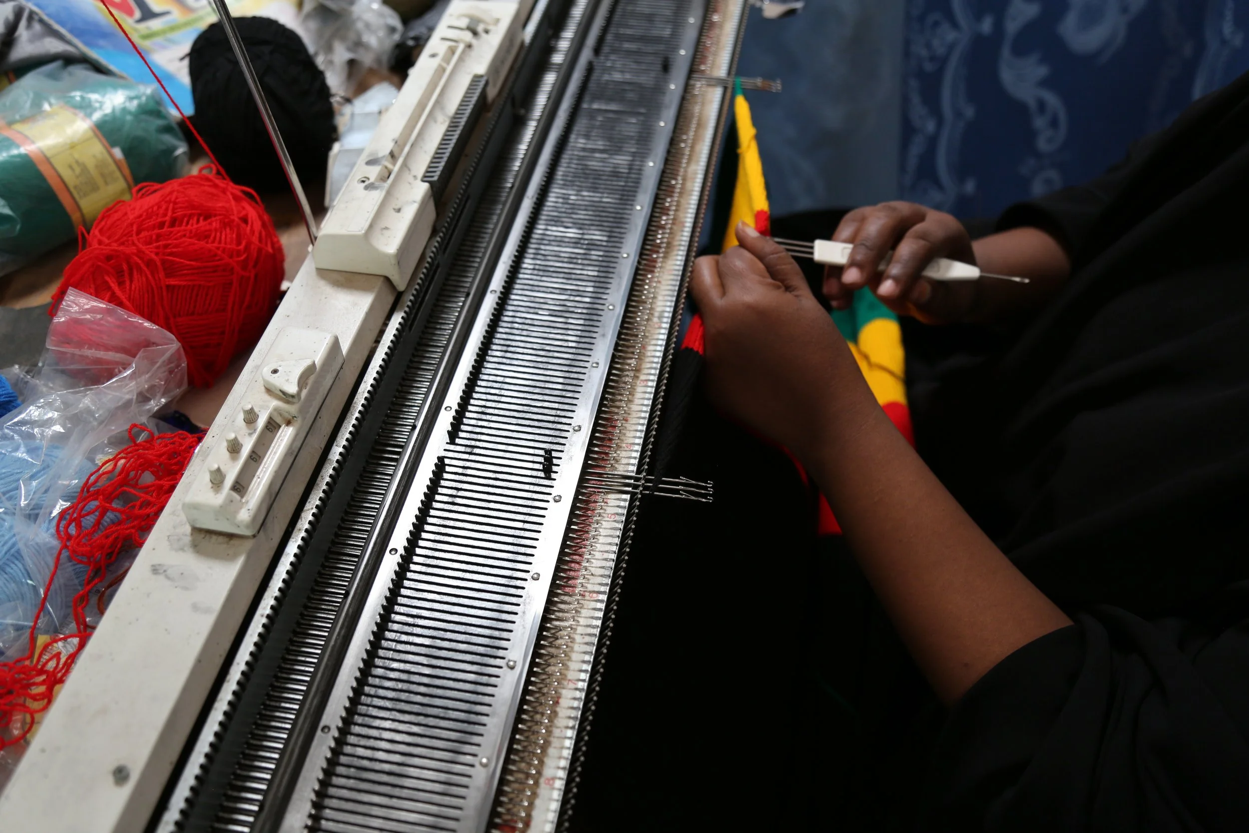 Sewing detail

Mariam Nininahazwe operates a sewing machine inside her tailoring workspace in Kakuma refugee camp, where she earns income making clothes for customers.