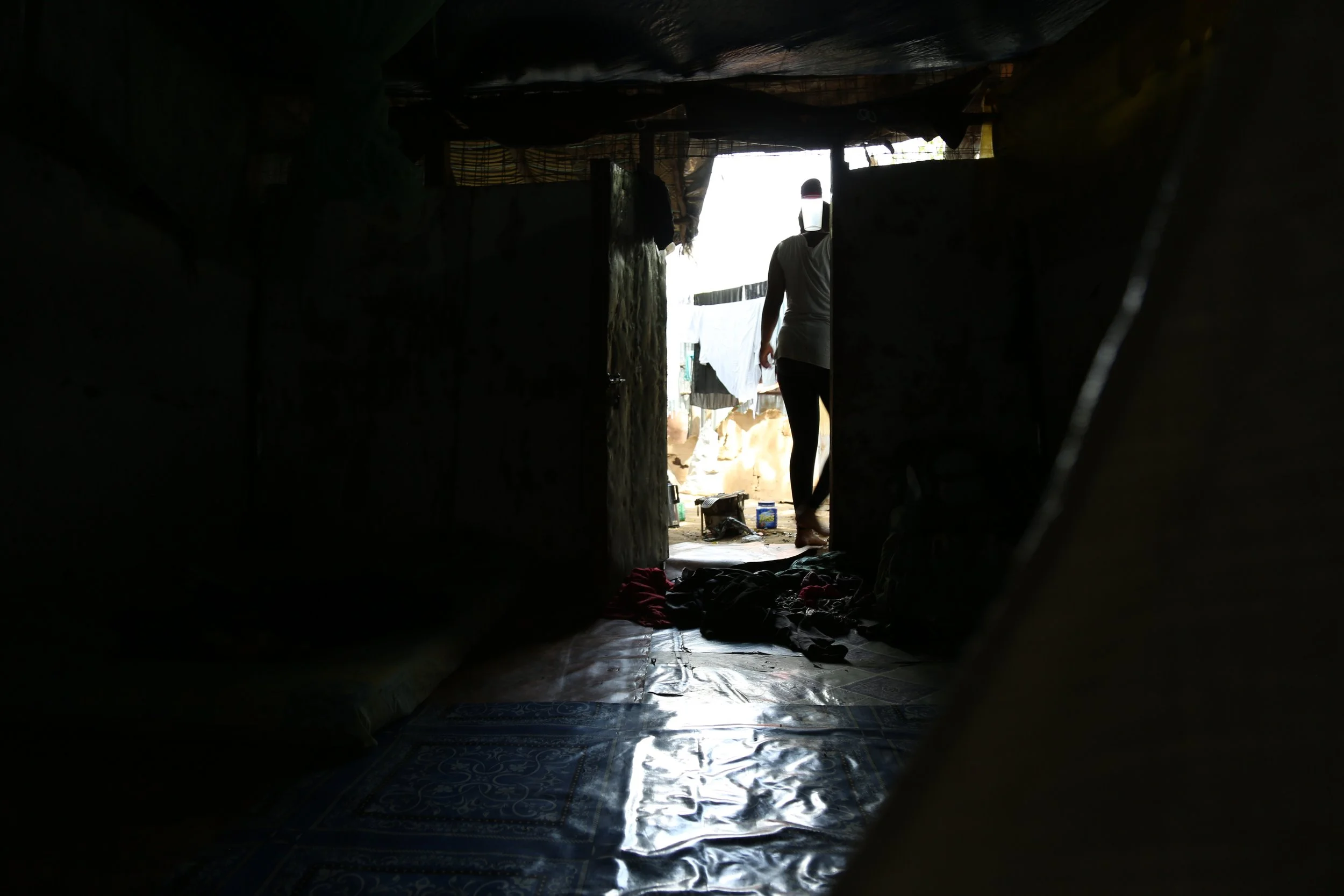 Inside Mariam’s home

View from inside Mariam Nininahazwe’s shelter in Kakuma refugee camp as she steps outside. Mariam runs tailoring and baking work from the home she shares with her children.