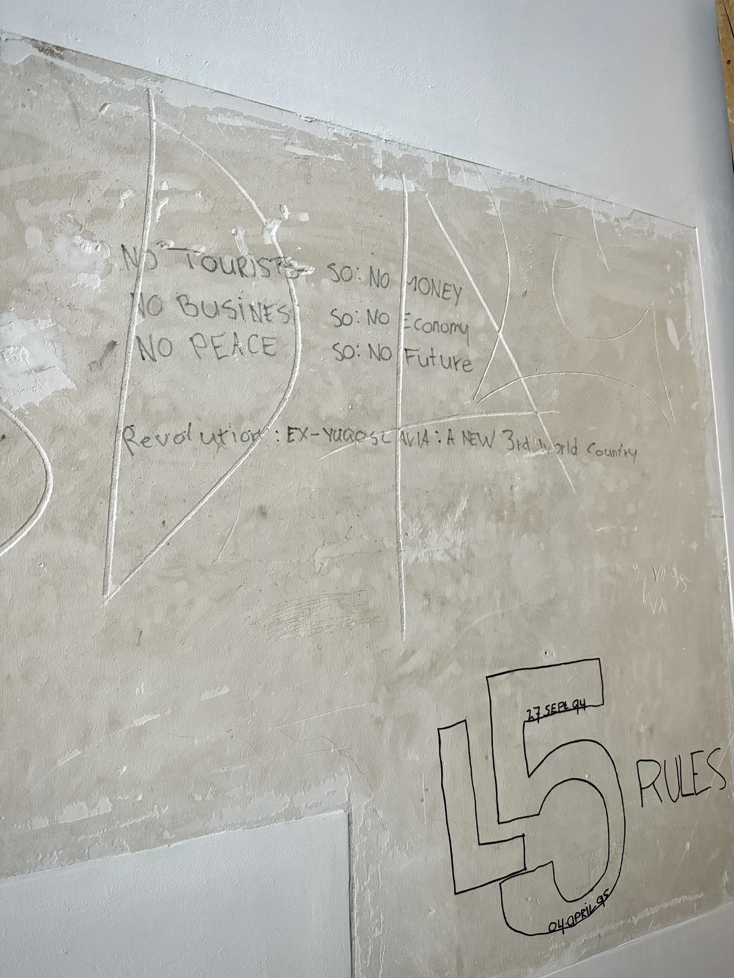 Graffiti and drawings remain on the walls of the former Dutch UN base (“Dutchbat”) at Potočari, preserved as they were in 1995. For many survivors, the site remains a symbol of an international presence that failed to act.