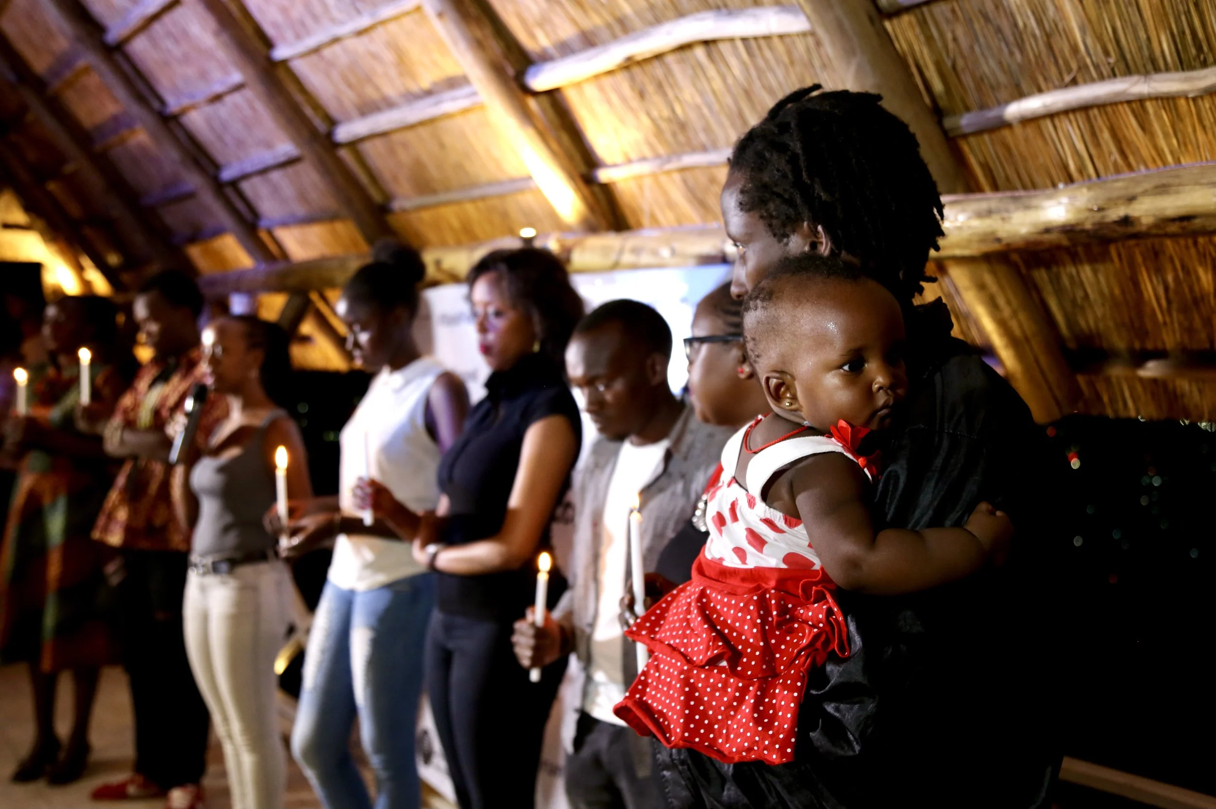 Burundian refugees, artists and activists gather during a #StandForBurundi spoken word and music event held at Pili-Pili Lounge in Kigali, Rwanda, on December 30, 2015. Organised by Spoken Word Rwanda, the evening raised funds for Burundian refugees 
