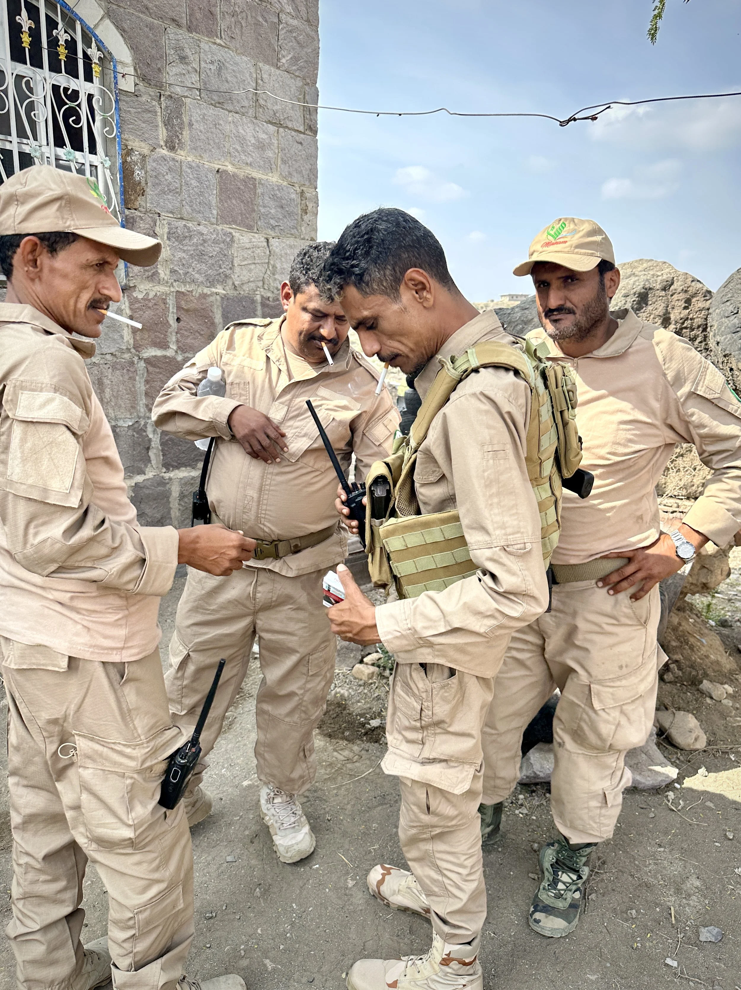 Project Masam demining team members at the end of a working day, Shakhab, Al Dhale. Teams like these have cleared the ground on which these families live, work and raise their children. Team leader Ahmed Al Radfani is on the left.