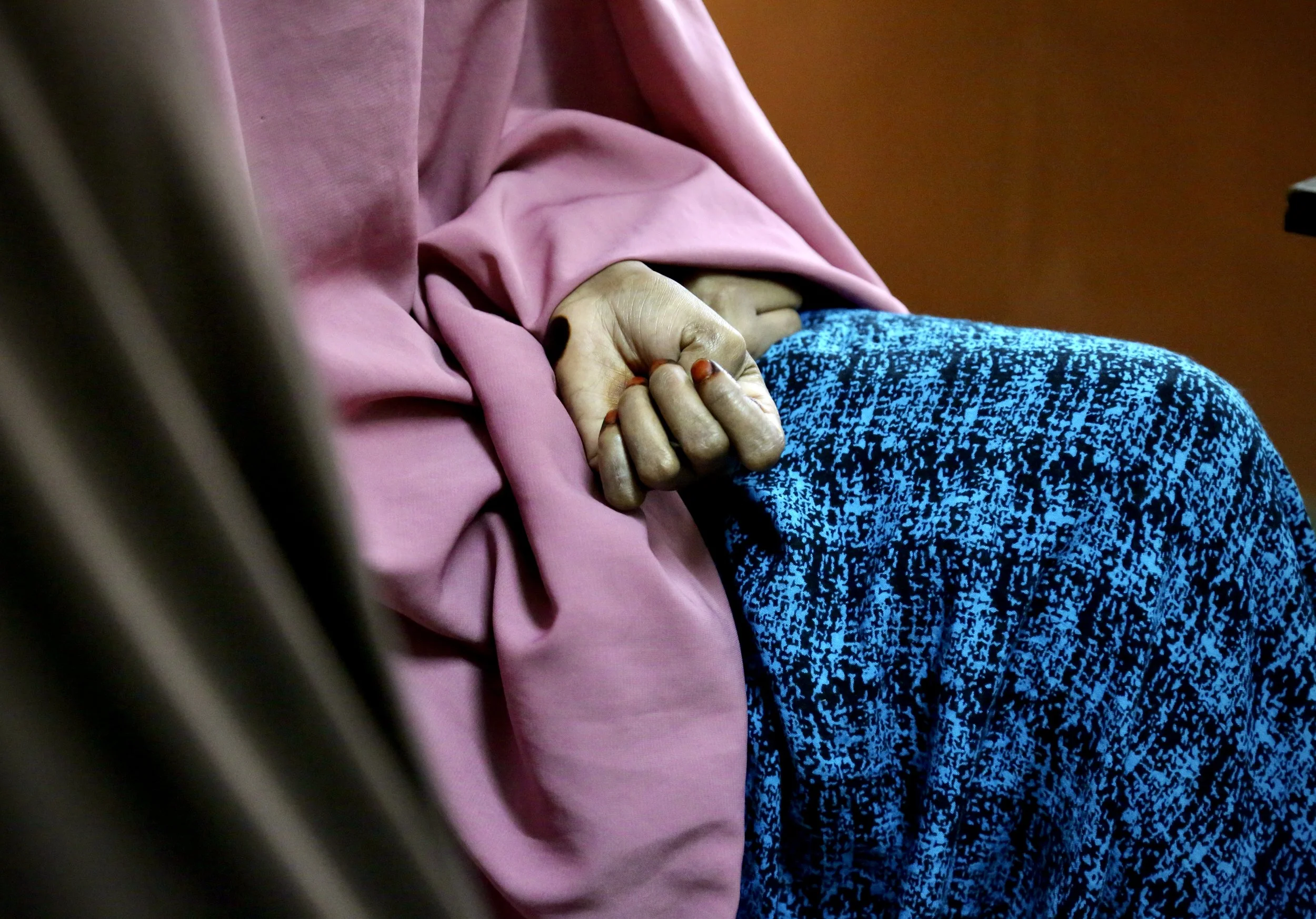 The hand of a Somali refugee woman during a meeting with legal and protection officers from a non-governmental organisation in Nairobi. The sisters' refugee documentation had expired and, without valid identification papers, they feared arrest, deten