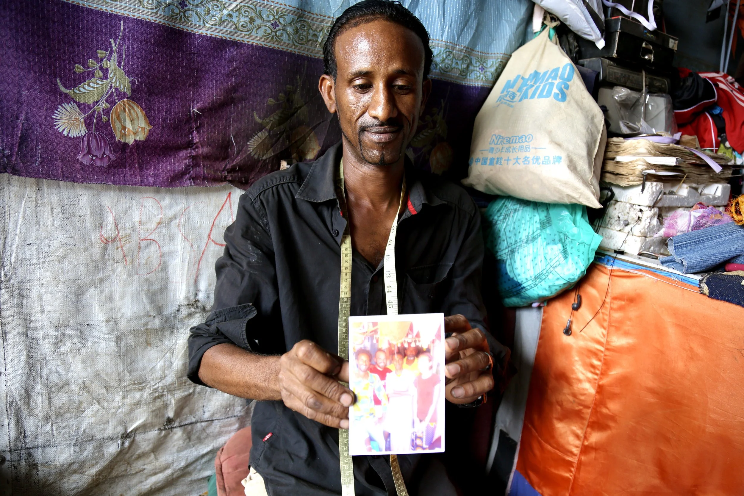 A photograph kept in the workshop references family and personal history.