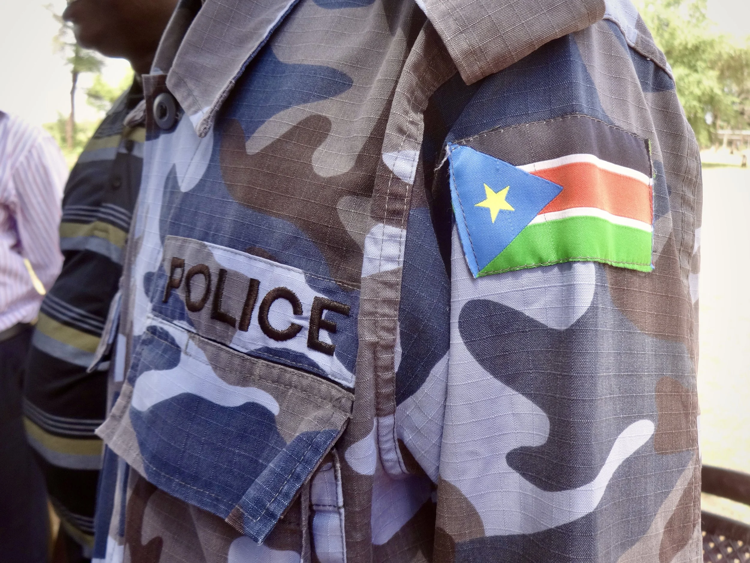 A police uniform bearing the South Sudan flag. Officials said they had been instructed to redirect asylum seekers under new conditions imposed at the border.