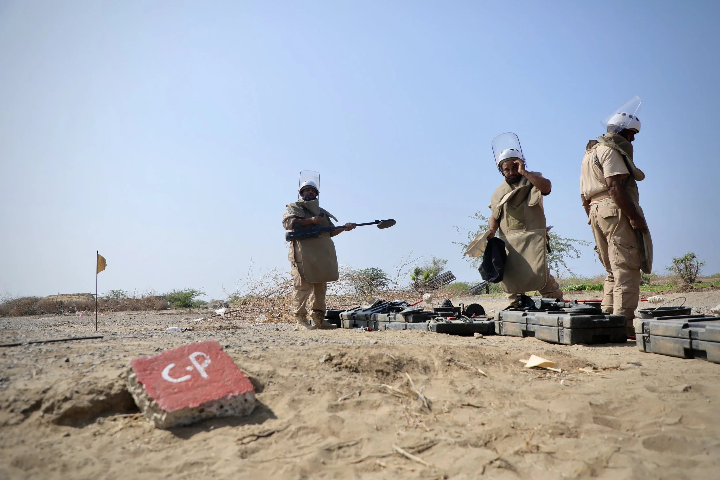 Deminers from Team 21 check their equipment before beginning clearance operations in designated safe lanes in Al Remah, near Mocha, Taiz governorate, Yemen.