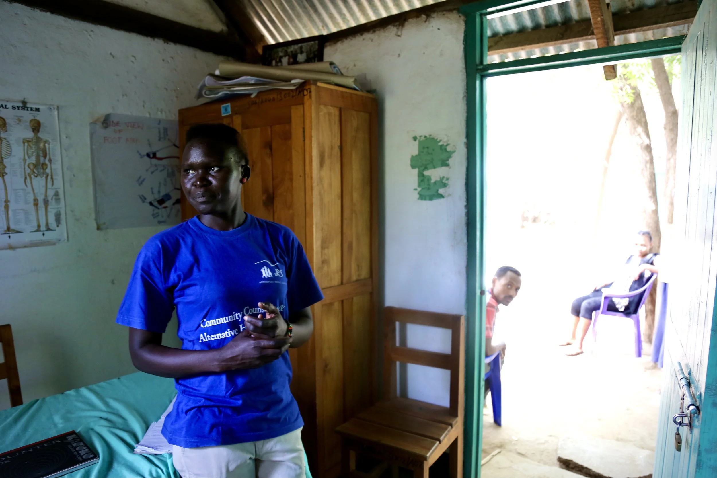 Monica Mburu, a South Sudanese refugee who helped run the Safe Haven, stands inside one of the shelter rooms where women received support and protection.