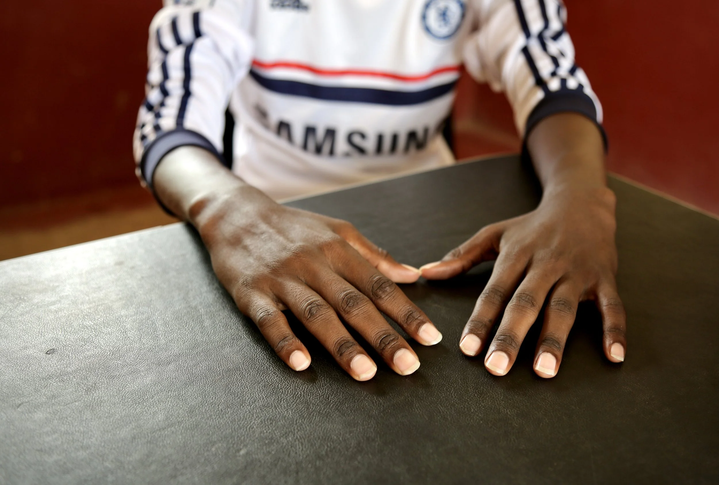 Hands of a 22-year-old Somali refugee in Kakuma refugee camp, Kenya. Speaking anonymously, he told IBTimes UK that reports of rape against Somali women and girls had become one of the community's greatest fears. "I'd rather die than have my mother, s