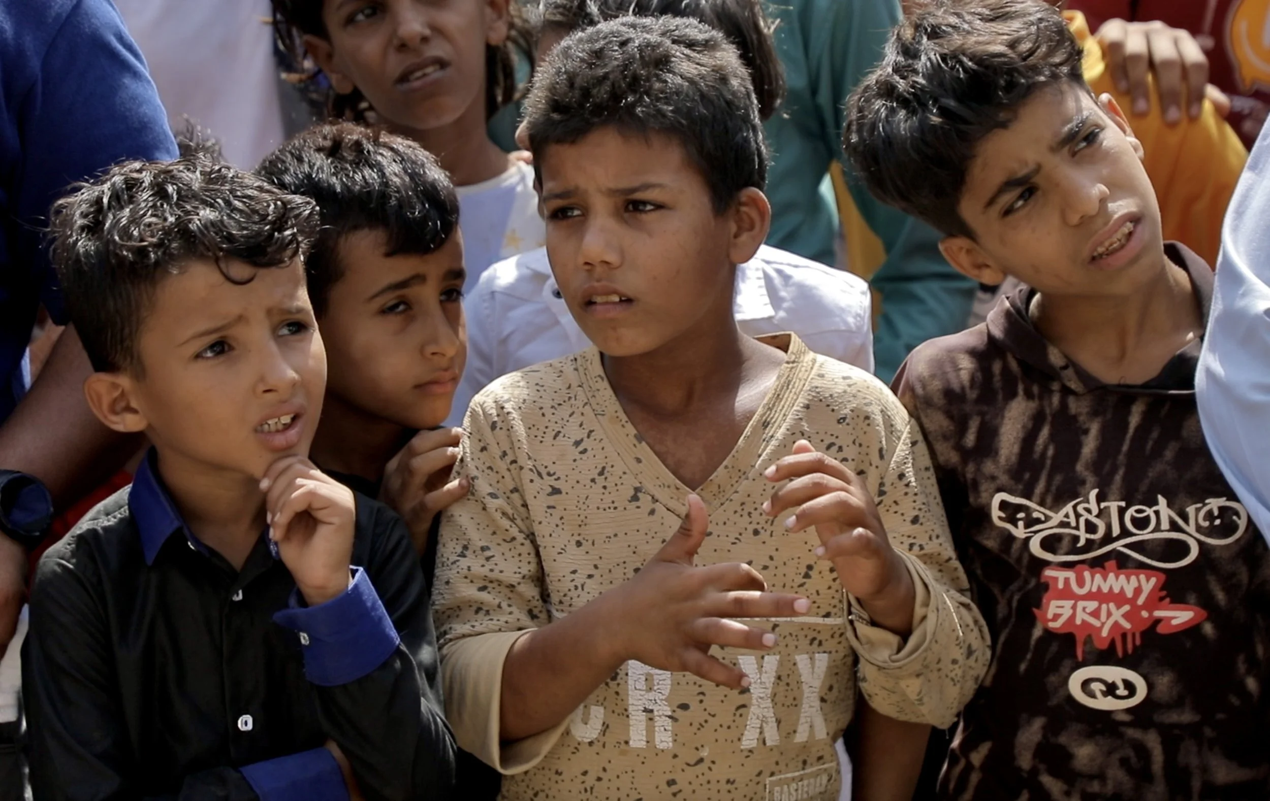 Boys listen during an Explosive Ordnance Risk Education session in western Taiz, Yemen. Educators say children are among the groups most at risk from landmines and unexploded ordnance, particularly in former frontline communities where explosive haza
