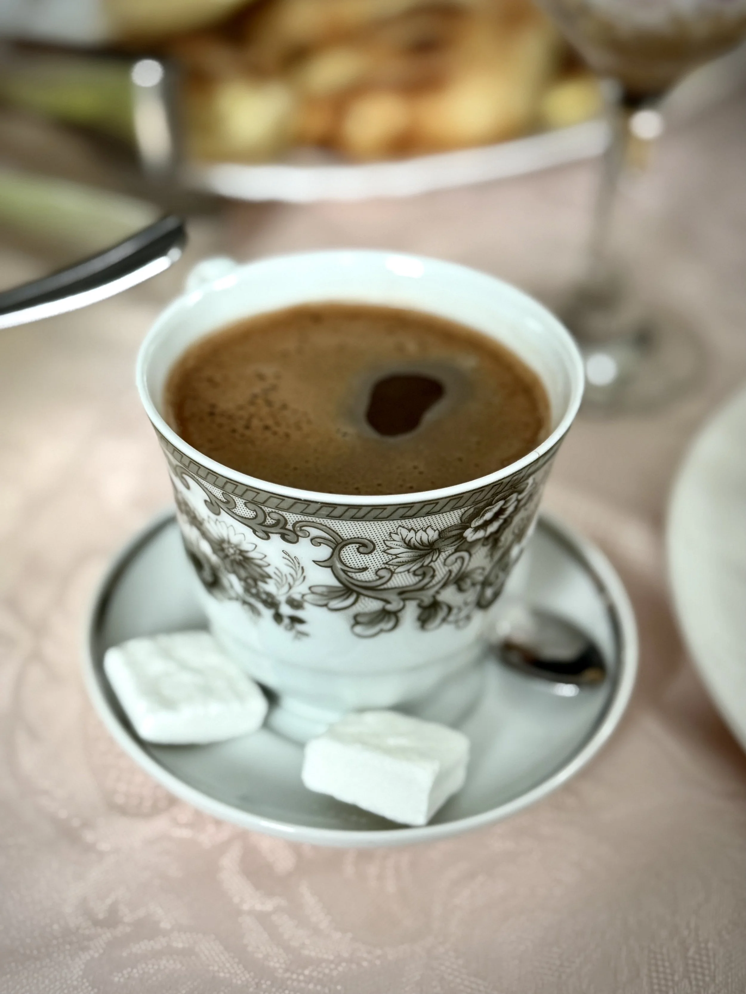 Bosnian coffee is served during a family visit. Hospitality remains a deeply rooted ritual in homes shaped by war, loss and survival.