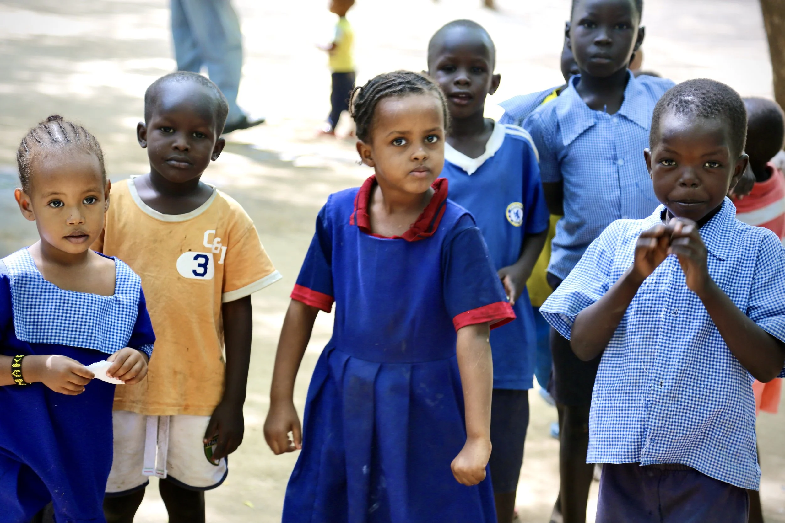 Children walk through the shelter compound in Kakuma. Many residents were the sons and daughters of women who had fled violence, abuse or severe insecurity.