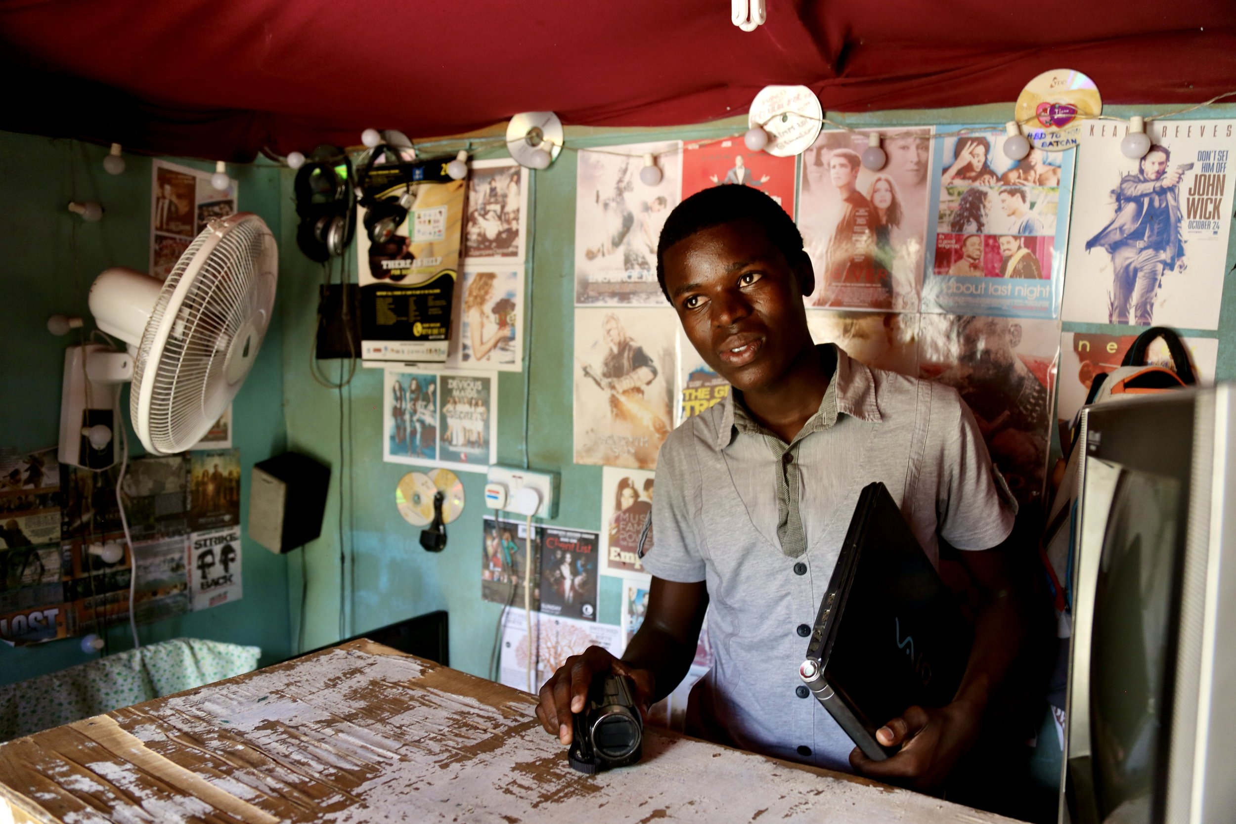 Fidele Wabenga at work inside his studio. Self-taught as a teenager, he used media as a tool for both livelihood and representation.