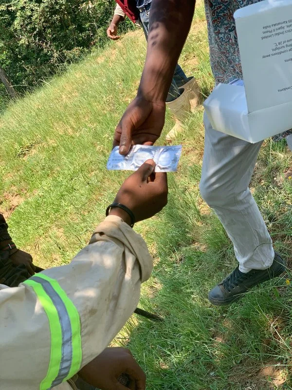 Peer educators distribute condoms to herd boys following a prevention session in Leribe district, part of efforts to improve access to sexual and reproductive health resources in remote grazing communities.