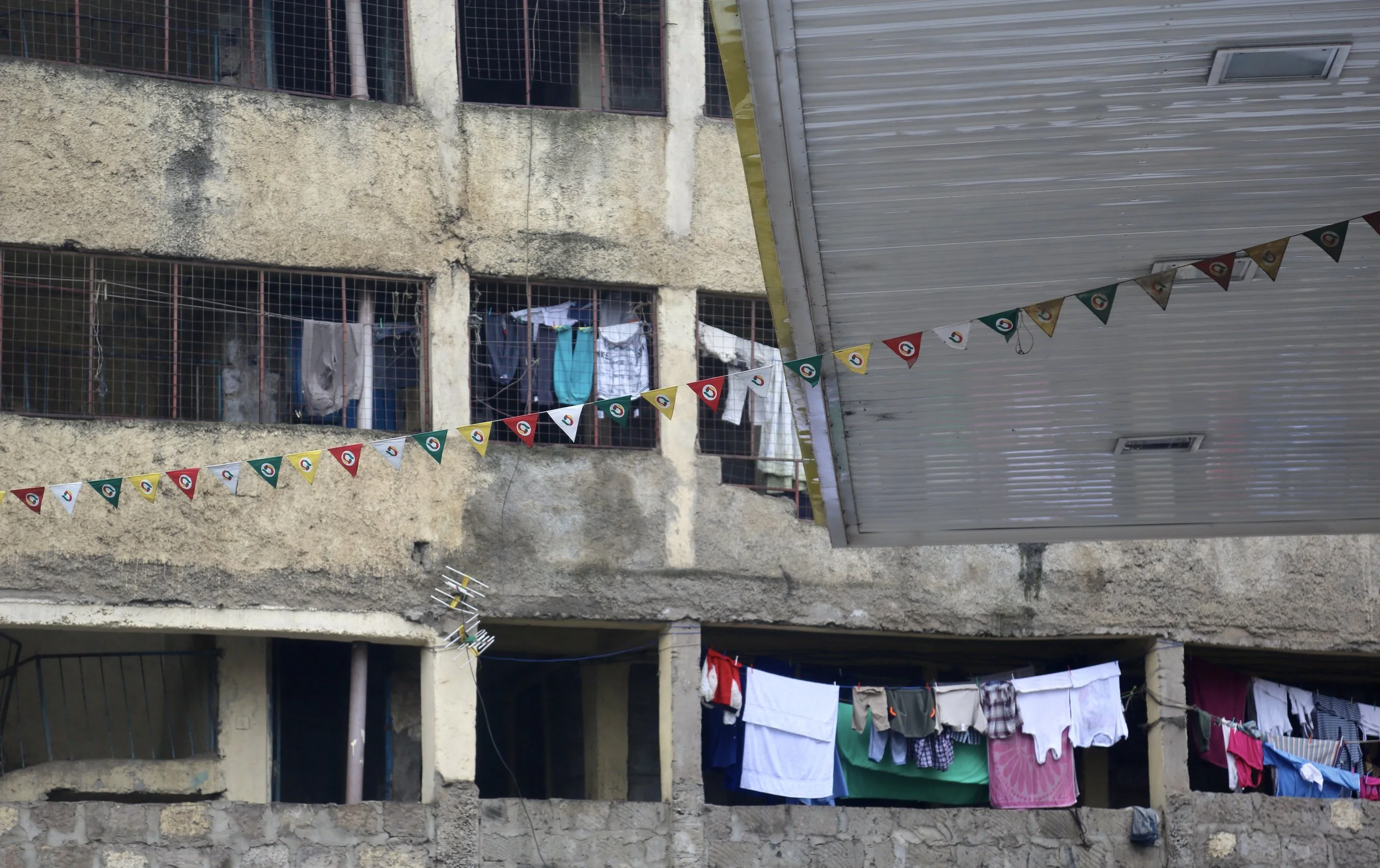 Laundry hangs from balconies in Eastleigh, Nairobi, a neighbourhood home to large numbers of Somali refugees and migrants. Many refugees who left Kakuma settled in the district hoping to find greater safety and opportunity. Nairobi, Kenya, June 2016.