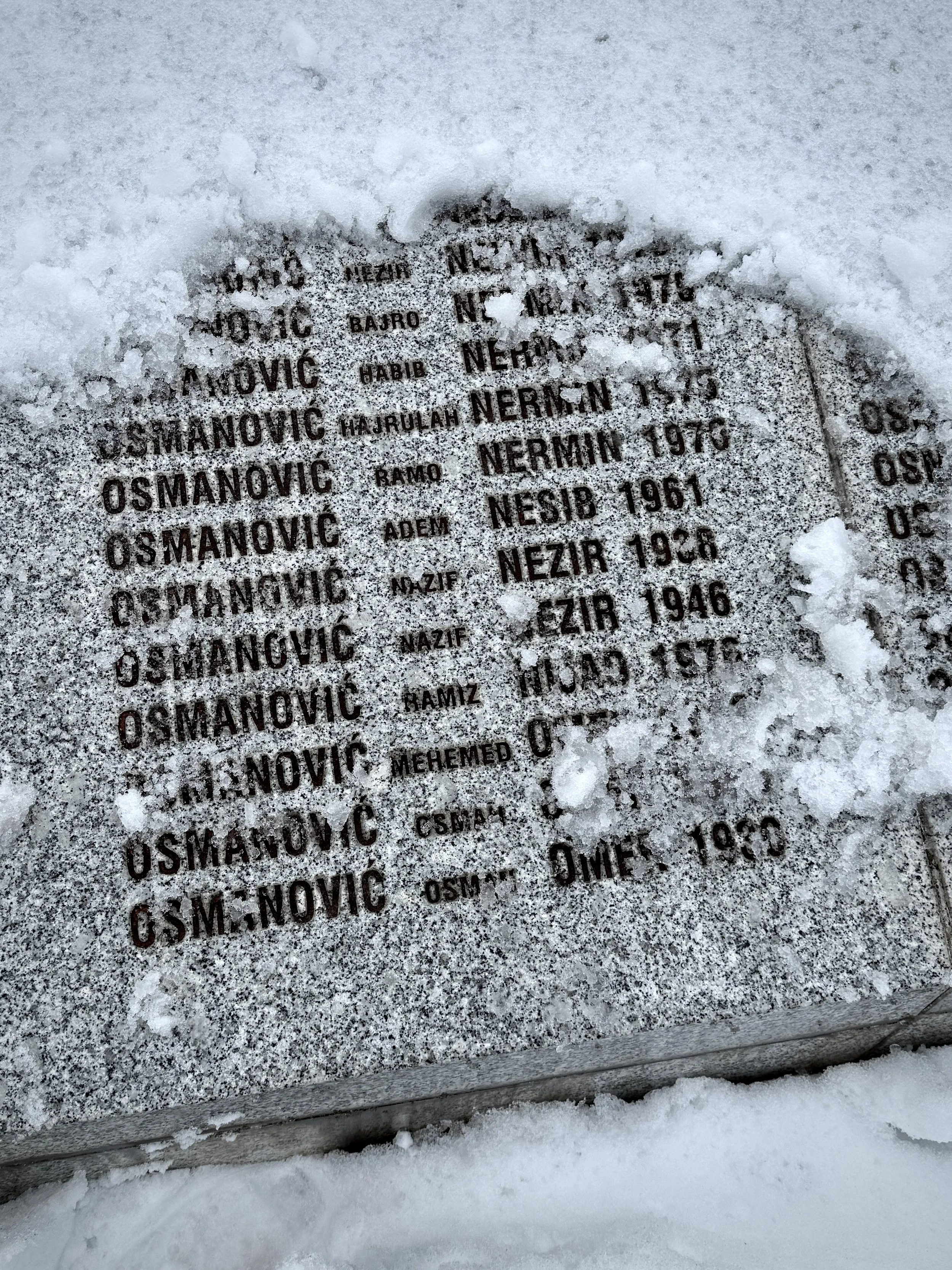 The names of Saliha Osmanović’s husband, Ramo, and sons, Ermin and Nermin, at the Srebrenica-Potočari Memorial Centre. Thirty years after the genocide, she still speaks of them in the present tense.