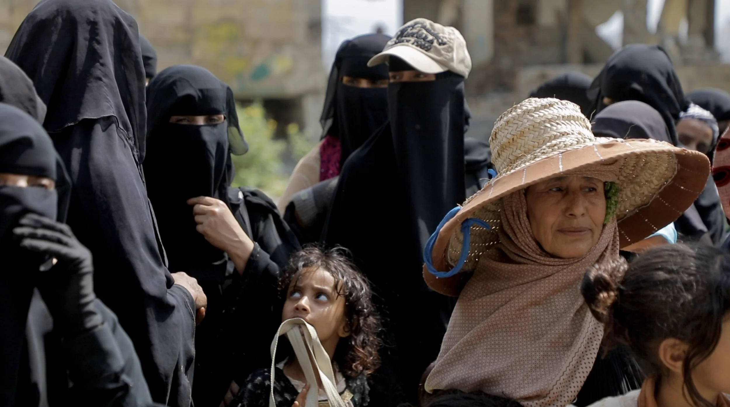 Women and children attend an Explosive Ordnance Risk Education session in Sabr Almawadim, western Taiz, Yemen. Humanitarian organisations and Yemeni educators say community-led and gender-sensitive awareness programmes have contributed to a reduction