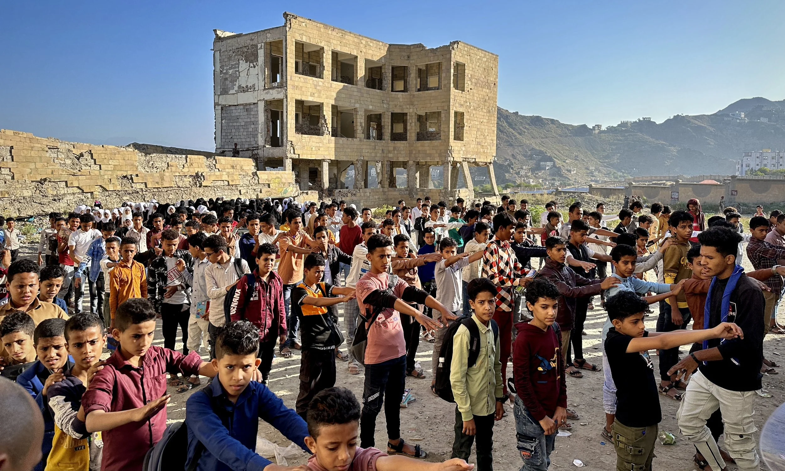Students line up in the courtyard of Ibrahim Aqeel School in Taiz, Yemen, during morning roll call and physical exercises before the start of the school day.