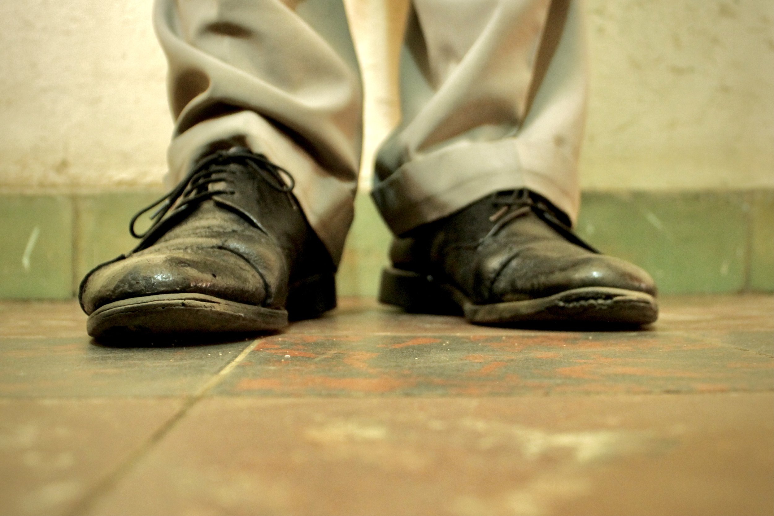 The worn shoes of P. Sinzinkayo in a safe location in Bujumbura. Following his release, he reported losing his livelihood and living in fear of further arrest.