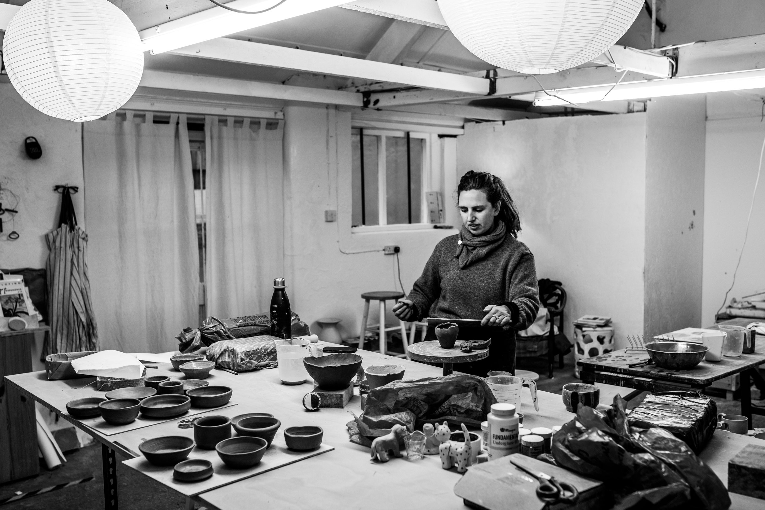 Potter at her bench