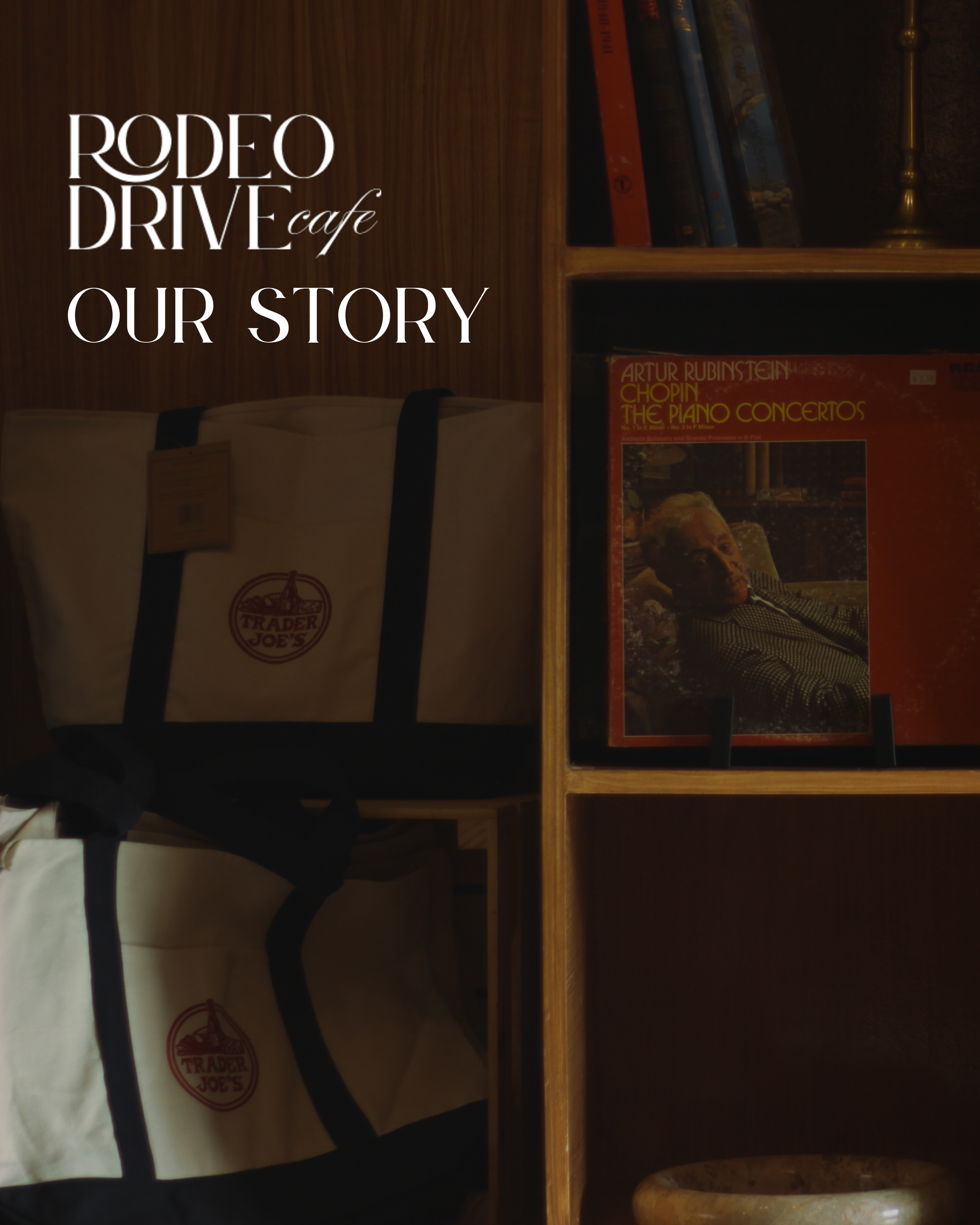 An interior view of a bookstore or library shelf with books and a magazine, a Trader Joe's shopping bag, and a lamp in the background.