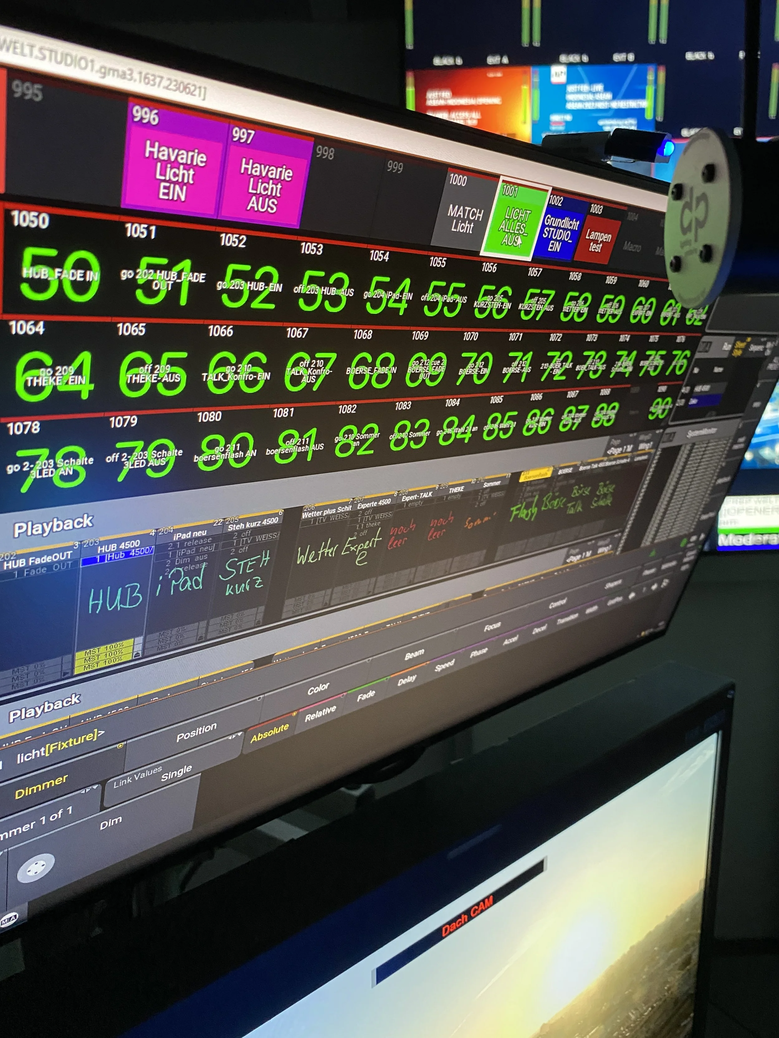 Computer screen displaying lighting control software with various color and lighting presets, labels, and settings in green, purple, blue, red, and gray, with handwritten notes in colorful ink.