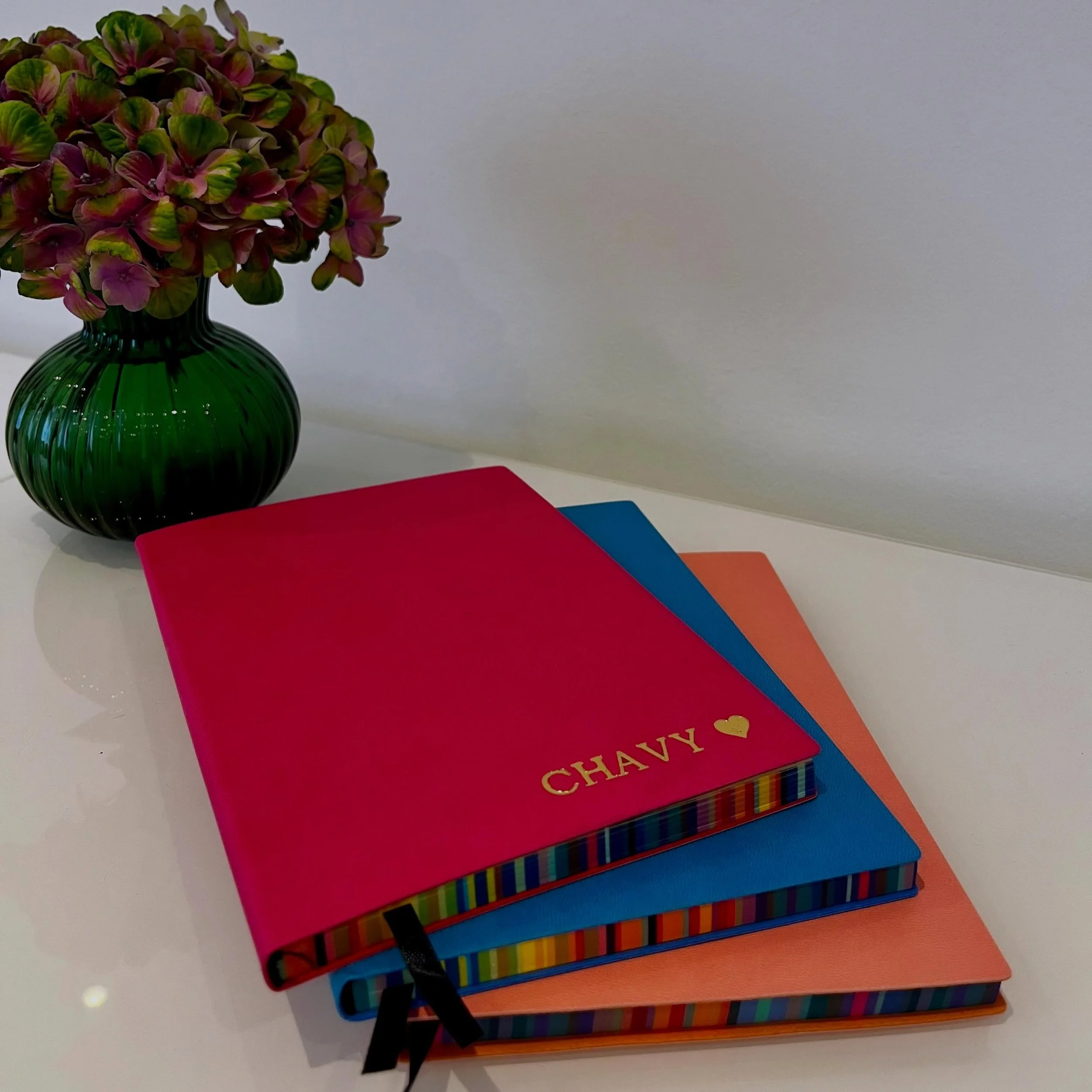 A beautifully crafted gold embossed notebook with rainbow page edges , designed to feel timeless, elegant, and personal.

The perfect gift for teachers, graduates, and girls beginning their seminary journey.

Personalised with a name for a meaningful