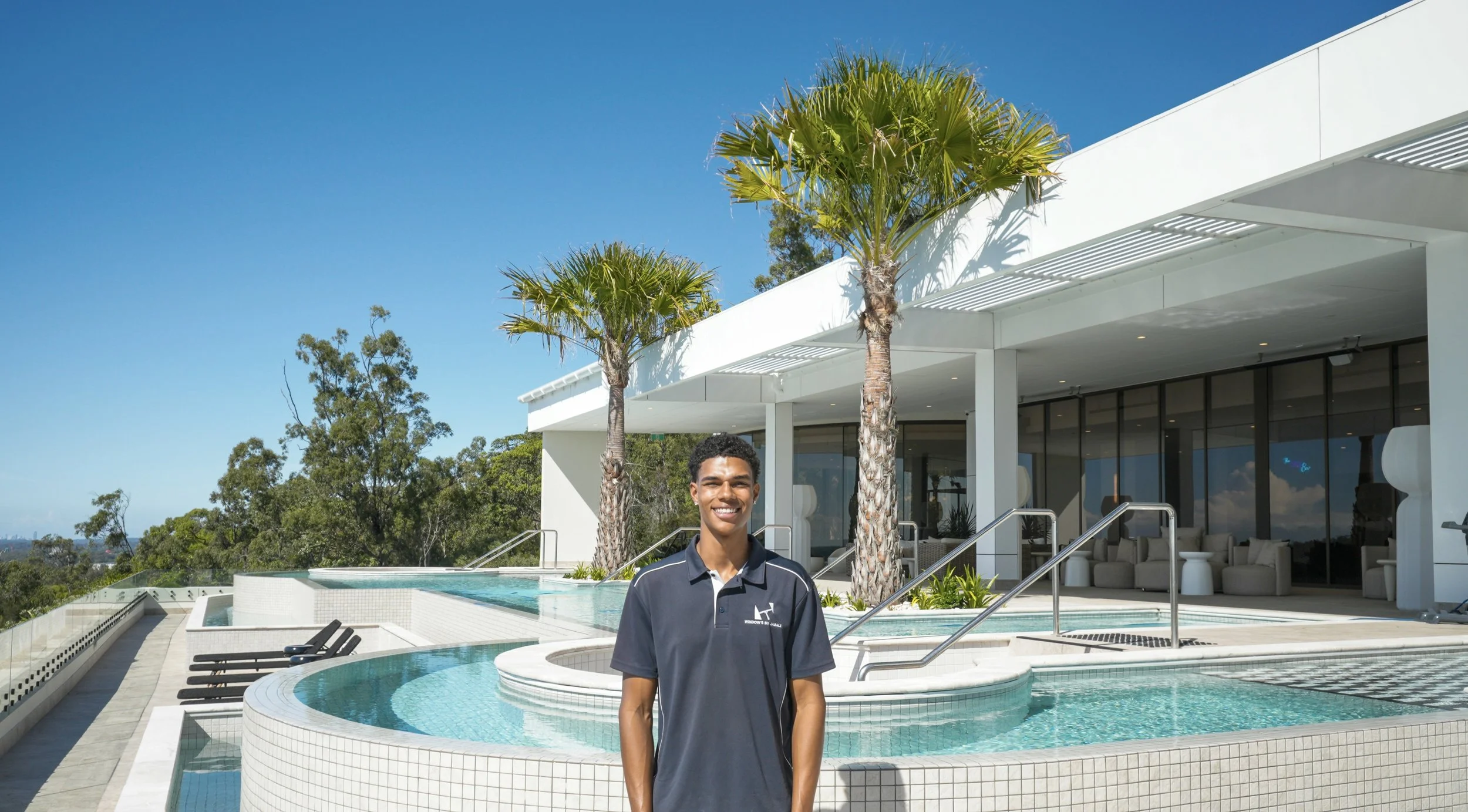 Jabali, founder of Windows By Jabali, on-site at a commercial property in Pimpama, Gold Coast.