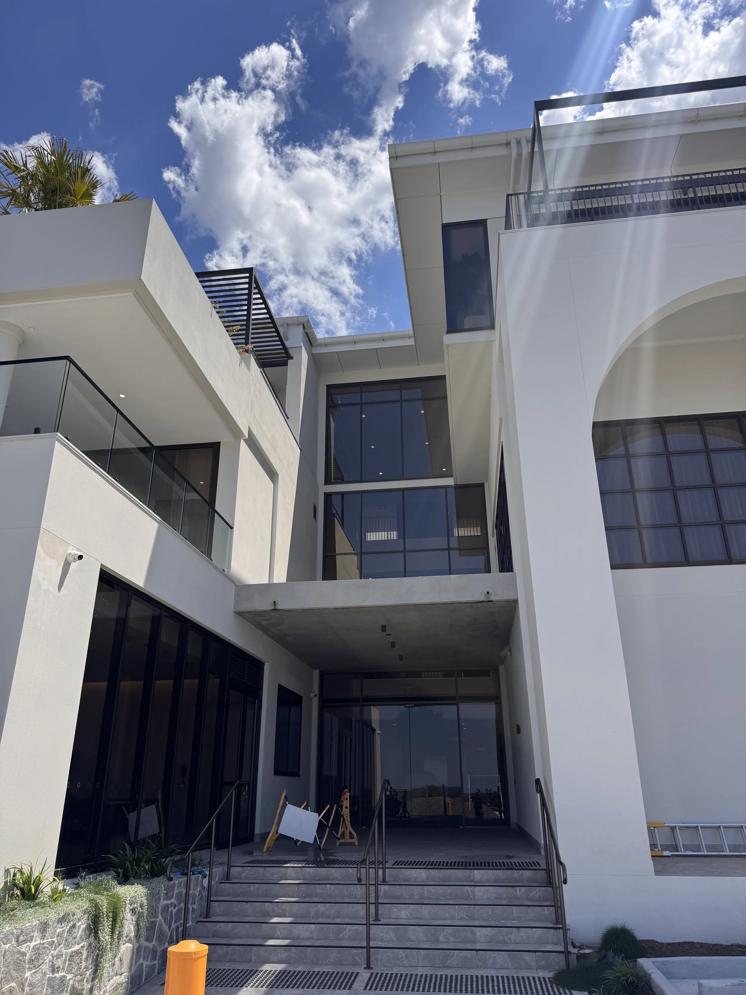 Multi-storey commercial building with extensive glazing cleaned by Windows By Jabali in Pimpama, Gold Coast.