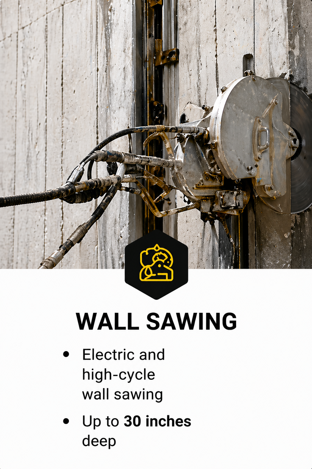 Close-up of a wall saw machine with hydraulic hoses and metal components, set against a concrete wall, with a black sign below that reads 'Wall Sawing, Electric and high-cycle wall sawing, Up to 30 inches deep'.