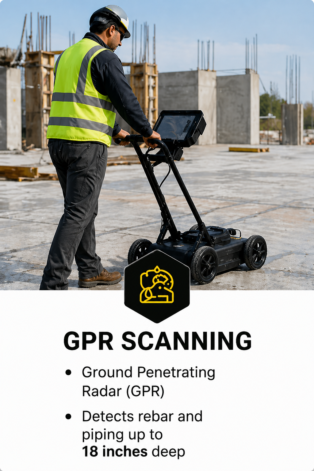 A construction worker in a yellow safety vest and helmet operating a ground penetrating radar (GPR) device on a building site with concrete structures in the background.