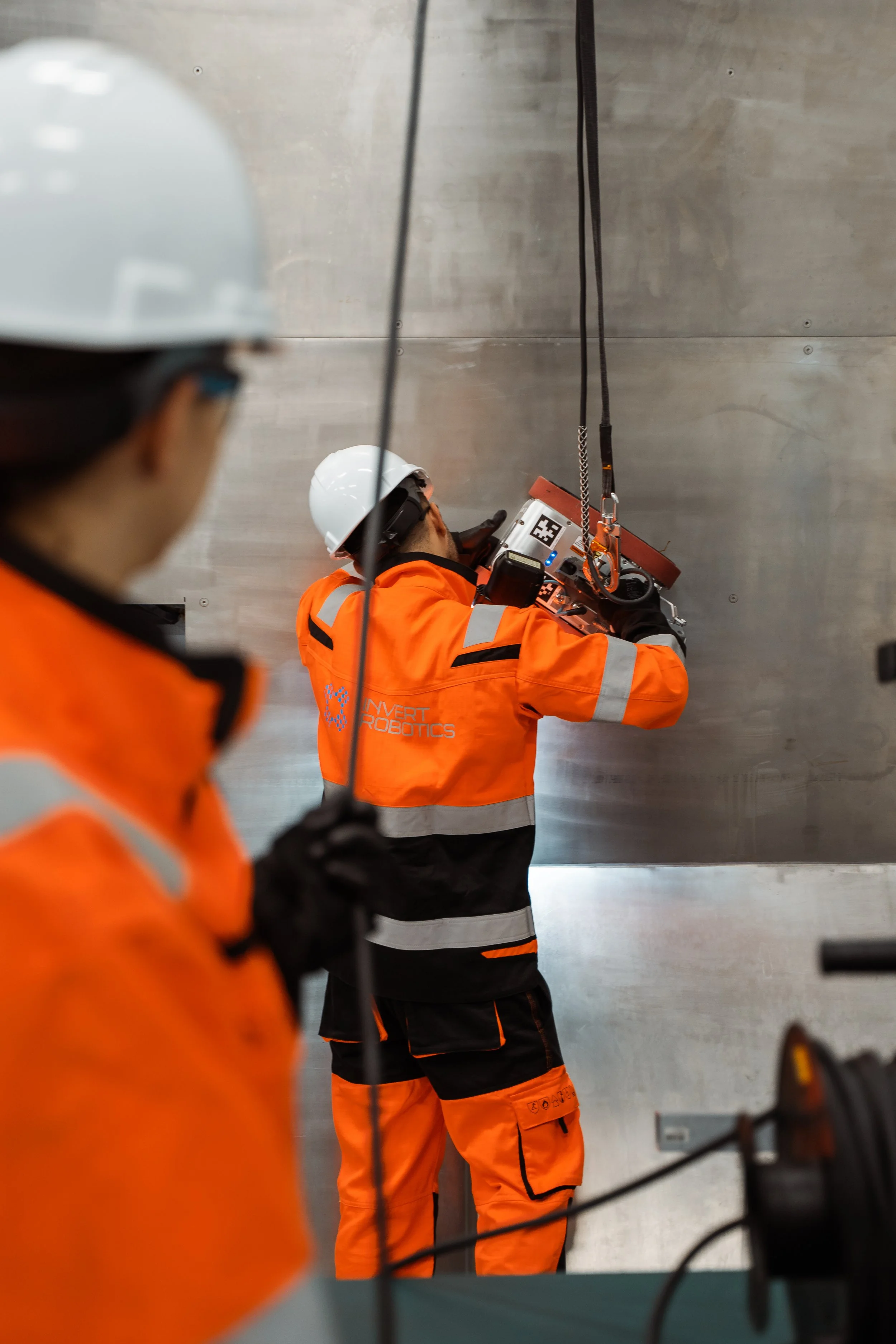 Invert Robotics Inspectors installing the Inspection climbing robot onto a stainless steel tank